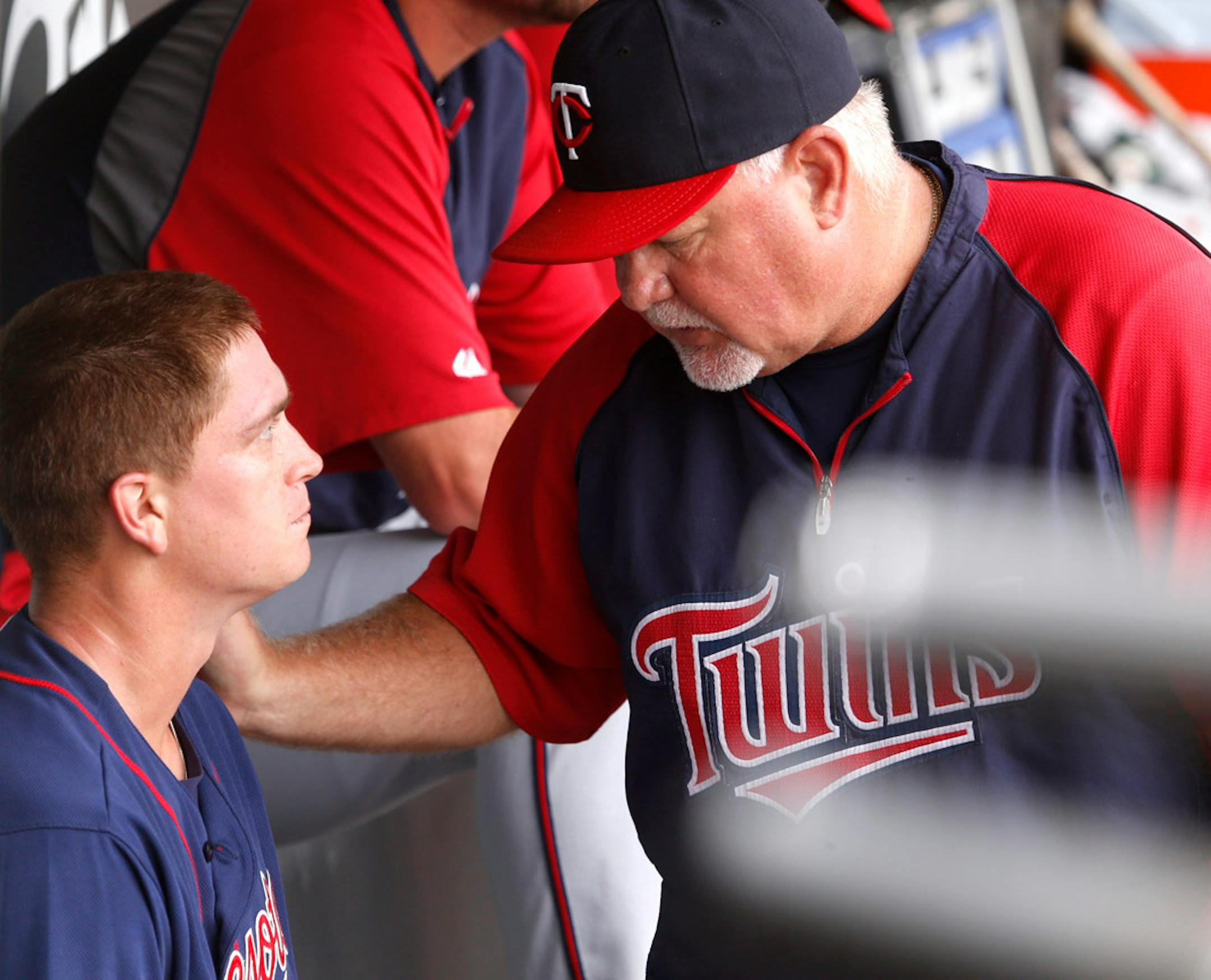 Minnesota Twins starting pitcher Kyle Gibson, left, listens to manager Ron Gardenhire in the dugout after Gardenhire pulled him from the game during the sixth inning of a baseball game against the Chicago White Sox, Friday, Aug. 9, 2013, in Chicago.