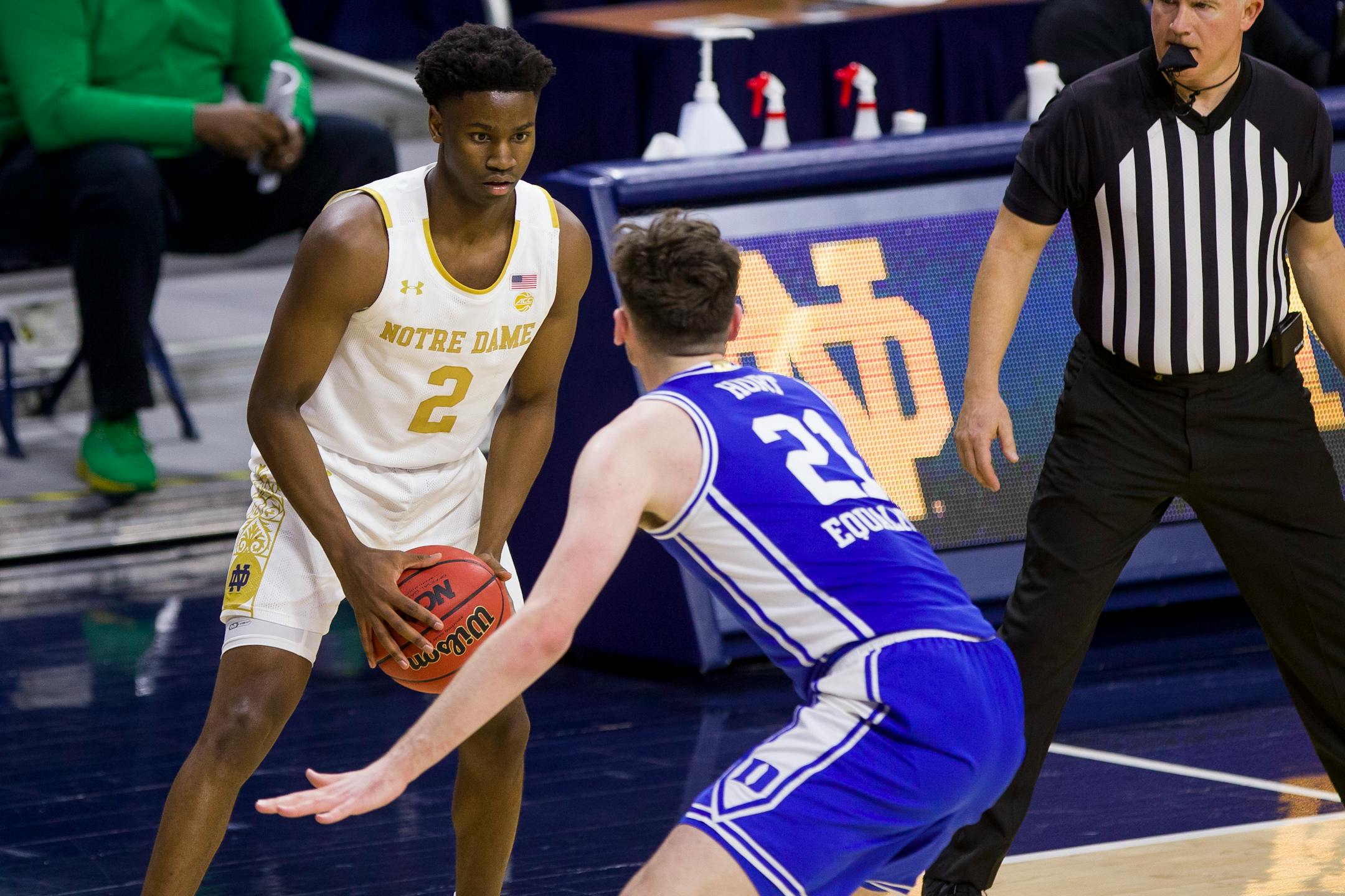 Notre Dame's Trey Wertz (2) holds the ball as Duke's Matthew Hurt (21) defends during an NCAA college basketball game Wednesday, Dec. 16, 2020, in South Bend, Ind. Duke won 75-65. (AP Photo/Robert Franklin)