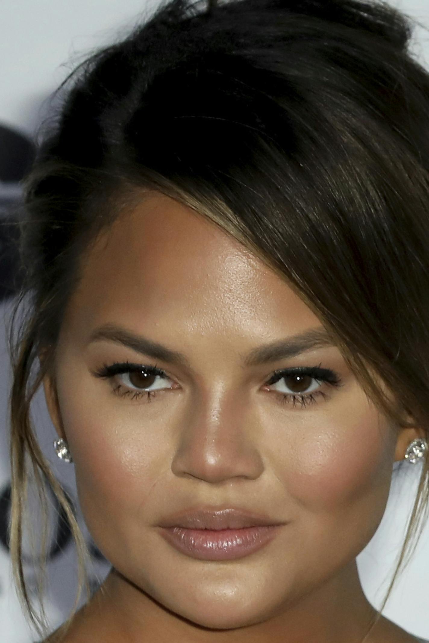 Musician John Legend and partner Chrissy Teigen pose for photographers on arrival at the 'GQ Men of The Year' Awards, Wednesday, Sept. 5, 2018. (Photo by Grant Pollard/Invision/AP)