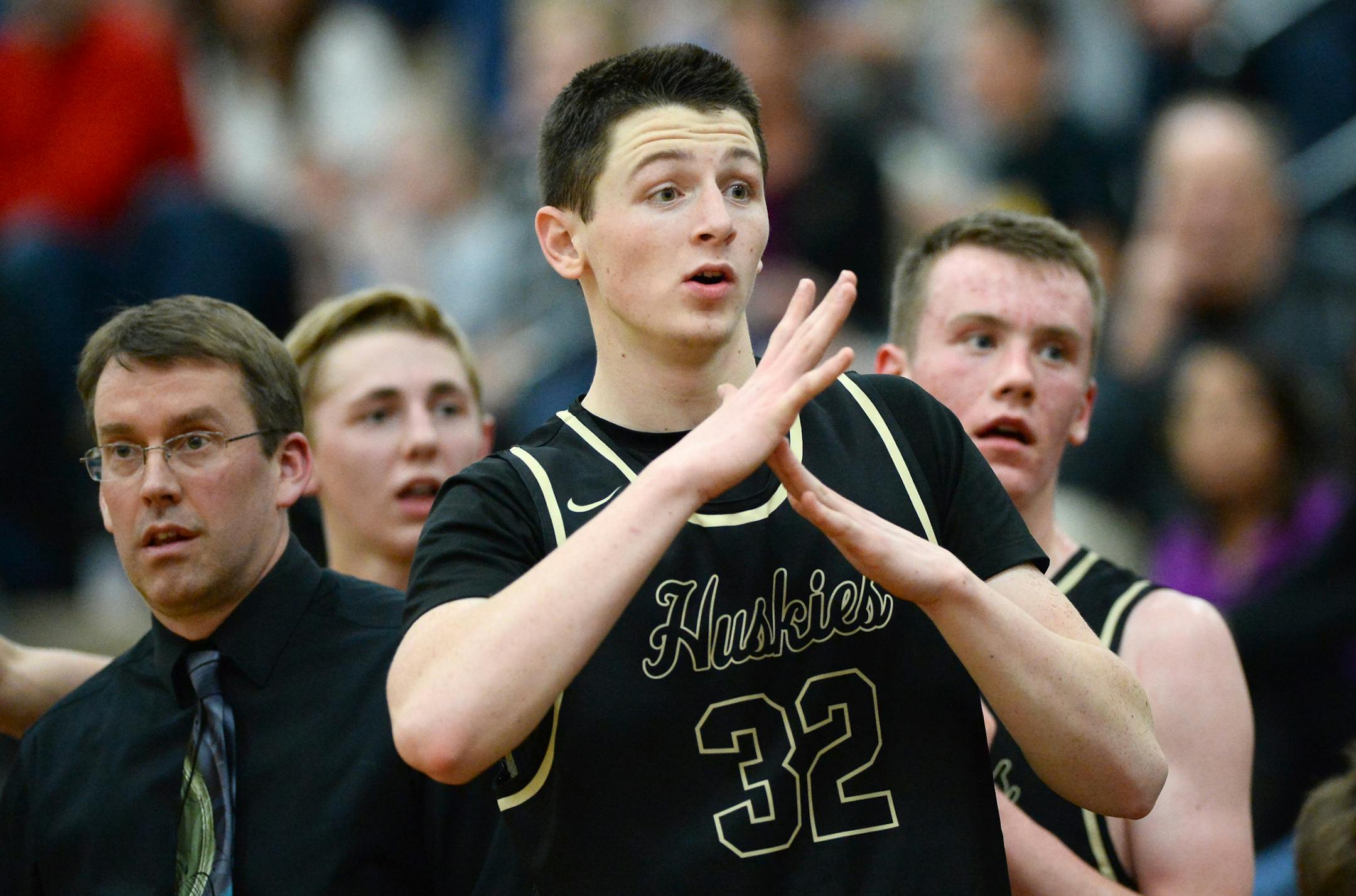 Andover Senior Luke Leisner (32) tried to call a timeout in the final minutes of Tuesday night's game agains Elk River. ] (AARON LAVINSKY/STAR TRIBUNE) aaron.lavinsky@startribune.com Andover senior basketball forward/center Luke Leisner has worked through many hardships to become a starter. Luke didn't make any of the three Andover traveling basketball teams as an eighth grader. However, he made the ninth grade team. He has seen his dad pass away, his house burn down, and his mom battle cancer.