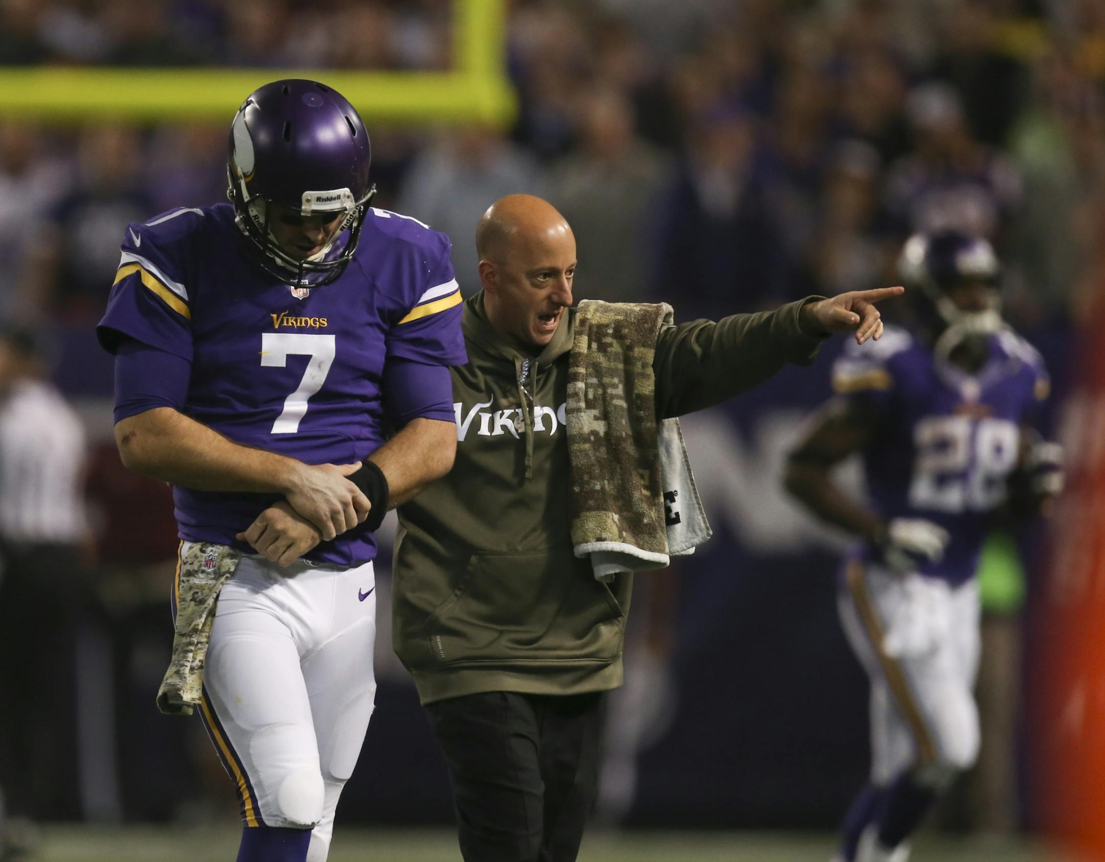 The MInnesota Vikings met the Washington Redskins in an NFL game Thursday night, November 7, 2013 at Mall of America Field in Minneapolis. Minnesota Vikings quarterback Christian Ponder (7) was attended to by a trainer after he was injured on a 15 yard keeper late in the third quarter. The initial touchdown call was reversed after review.