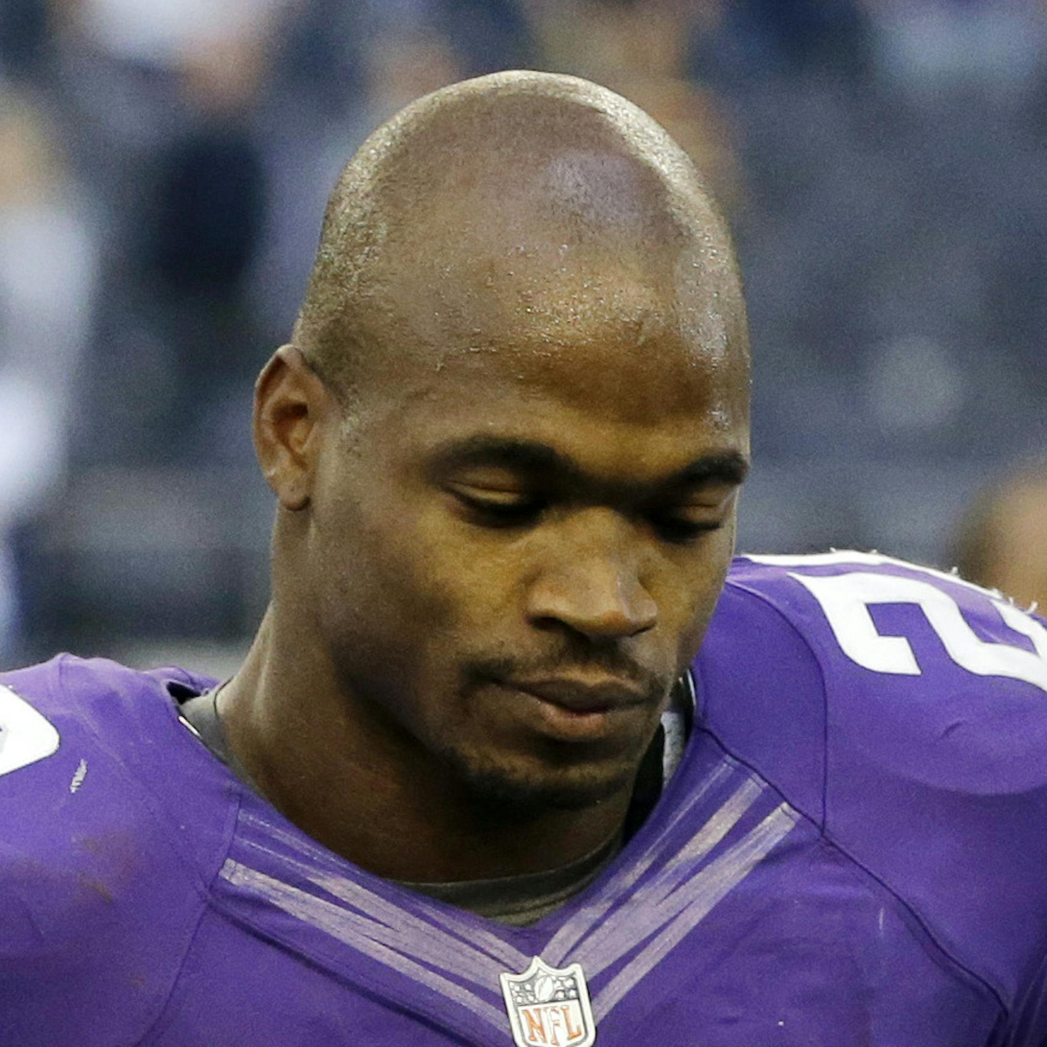 Minnesota Vikings' Adrian Peterson (28) walks off the field following their 27-23 loss to the Dallas Cowboys in an NFL football game, Sunday, Nov. 3, 2013, in Arlington, Texas. (AP Photo/Nam Y. Huh)