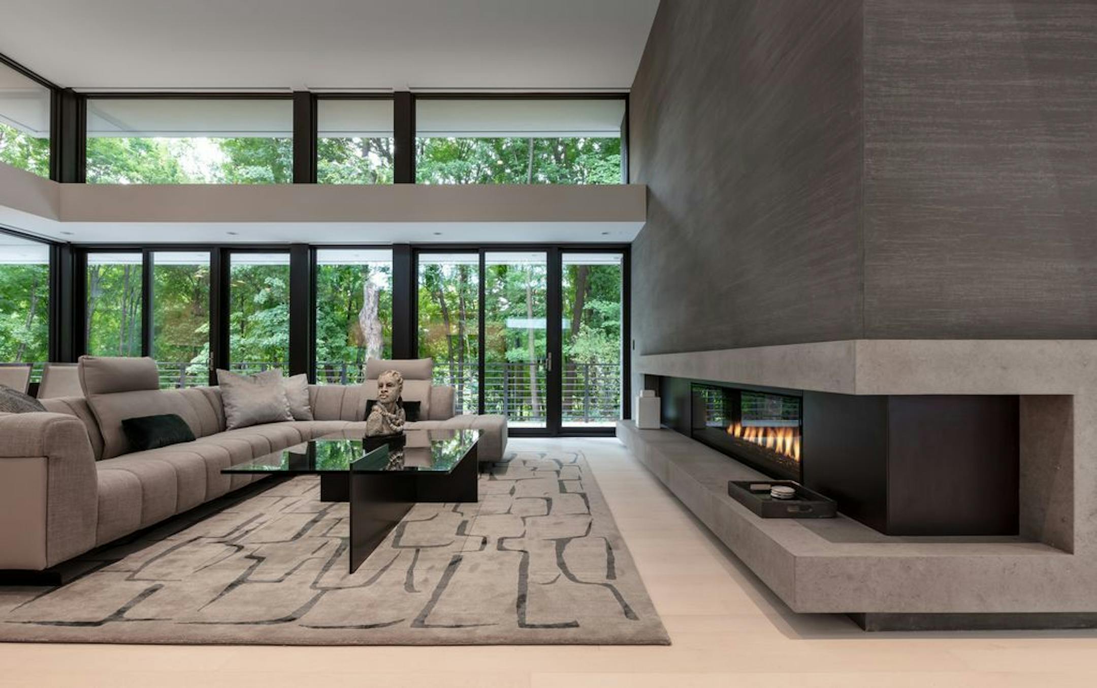 The living room in this Deephaven home features a dramatic fireplace.
