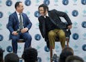 Minnesota Timberwolves President of Operations, Gersson Rosas, left, and D'Angelo Russell, took to a stage in laughter during a press conference at th