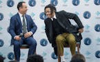 Minnesota Timberwolves President of Operations, Gersson Rosas, left, and D'Angelo Russell, took to a stage in laughter during a press conference at th