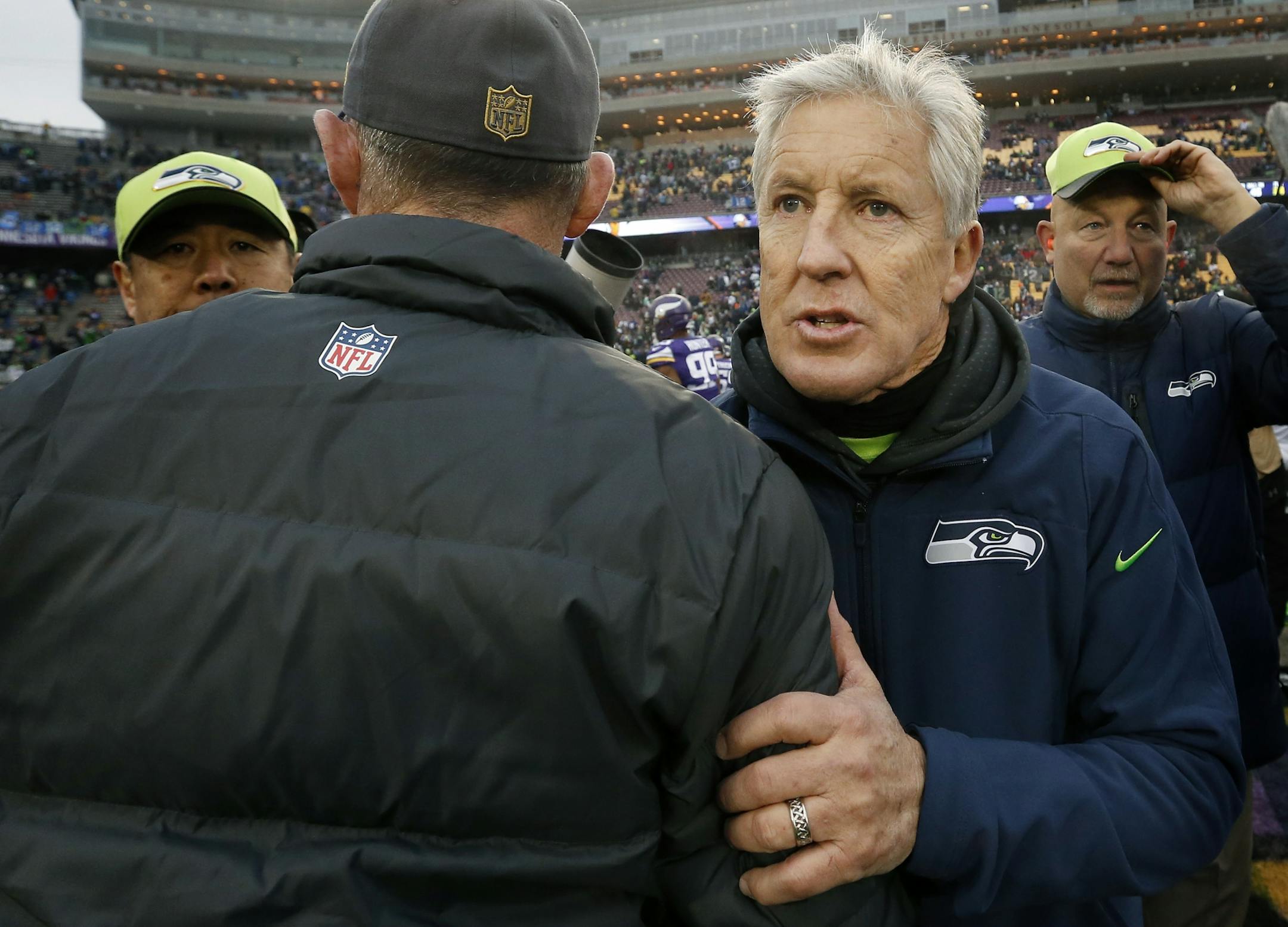 Minnesota Vikings head coach Mike Zimmer and Seattle head coach Pete Carroll at the end of the game.