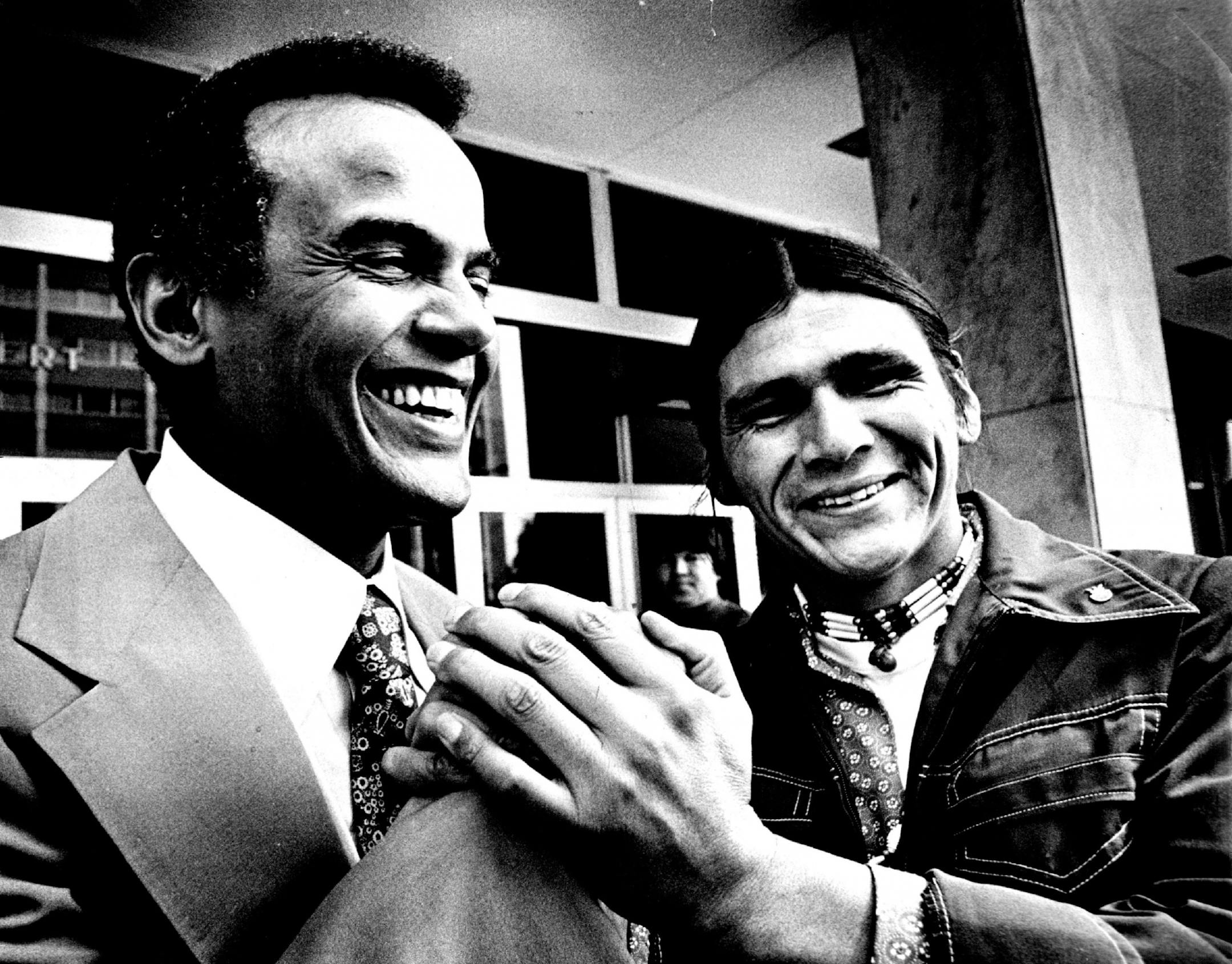 August 29, 1974: Singer Harry Belafonte, left, paused outside the St. Paul Federal Building Wednesday with AIM leader Dennis Banks, a co-defendant in the Wounded Knee trial. Belafonte, who attended the trial with his family yesterday, said he believes that AIM is in a position similar to that of black civil-rights organizations of the 1960s. "What's really on trial here," he said, is the validity of AIM."