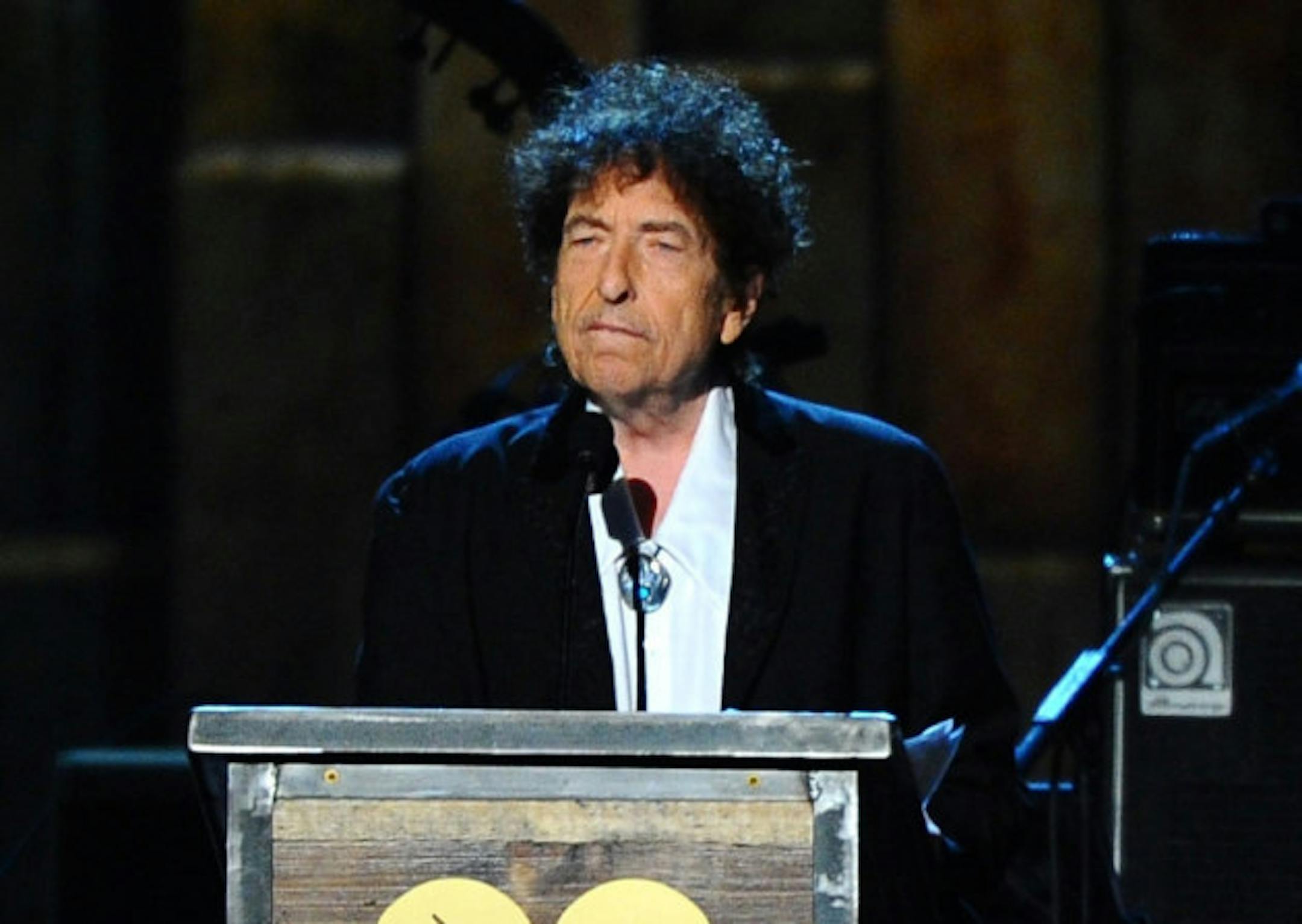 Bob Dylan at the podium for the MusiCares Person of the Year ceremony in 2015. / Photo by Vince Bucci, Invision/AP