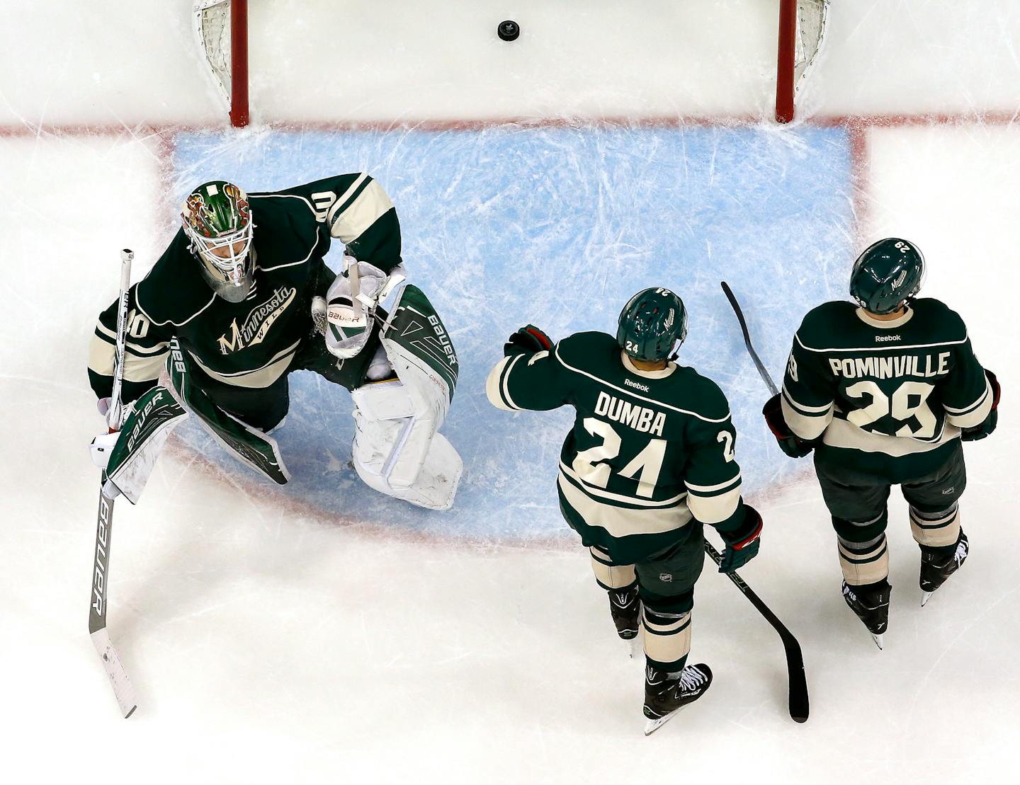 Minnesota Wild goalie Devan Dubnyk (40), Matt Dumba (24), and Jason Pominville (29) reacted after a go ahead goal by Jason Spezza in the second period.