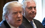 FILE-- Secretary of State Rex Tillerson, right, listens as President Donald Trump speaks during a meeting with Malaysian Prime Minister Najib Razak in