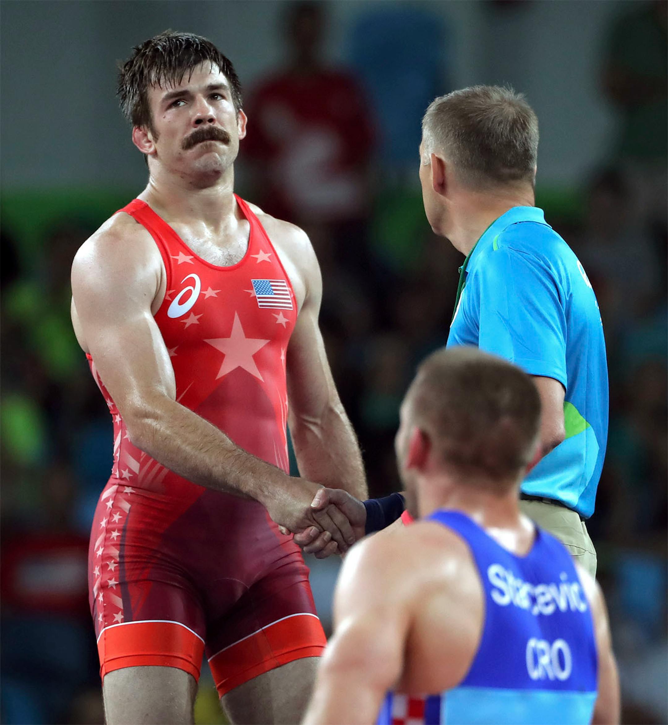 Andy Bisek of Chaska won his first match at the Olympics on Sunday, beating Yurisandi Hernandez Rios of Cuba 1-0 in the Greco-Roman 75-kilogram (165 pounds) division at Carioca Arena 2. Unfortunately Bisek lost his second match to Bozo Starcevic of Croatia in the quarterfinal match. Here, Bisek shakes the refereeís hand after the match.