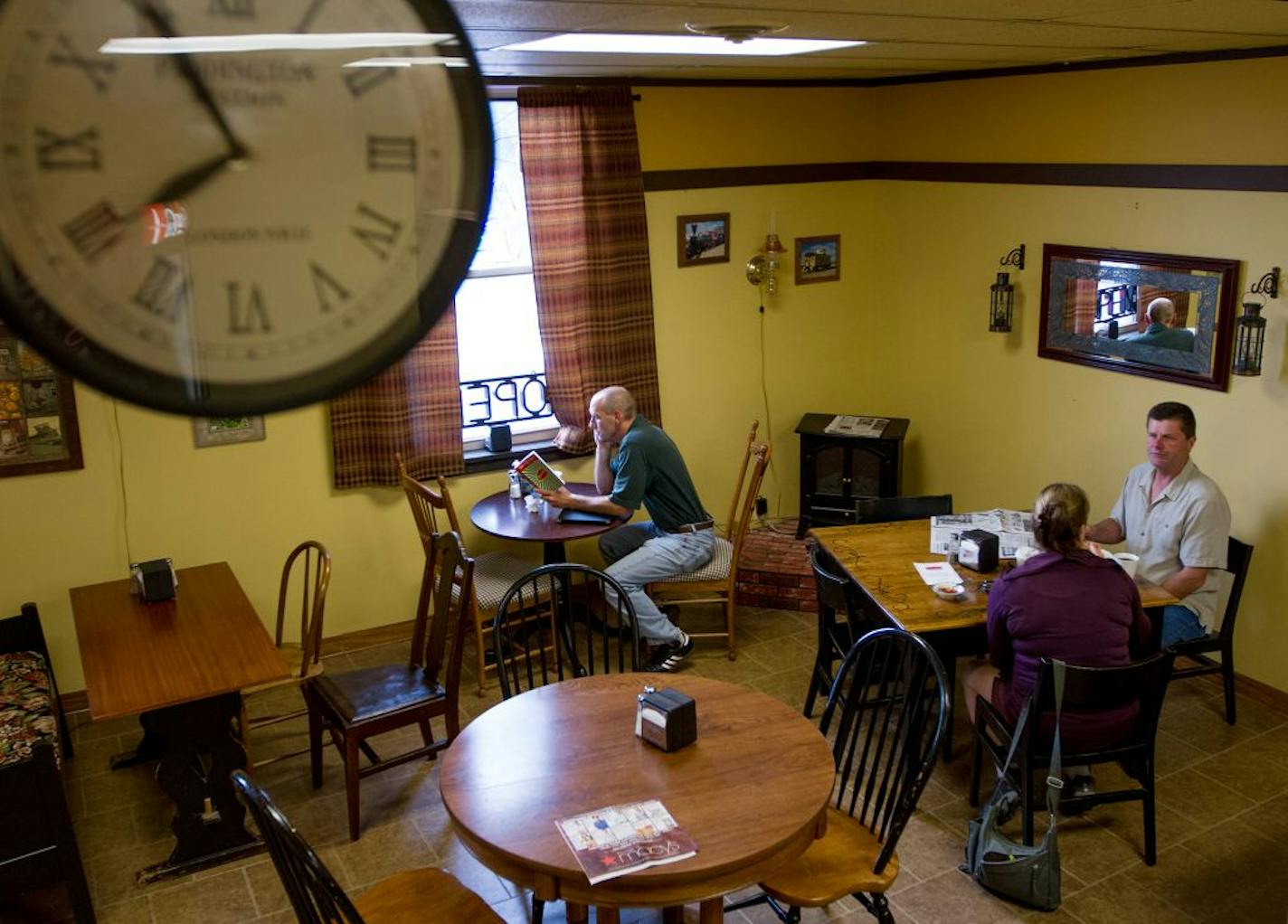 A Paddington Station clock hangs above the Coffee Caboose which sits next to a Northstar Park and Ride in Anoka, Minn.