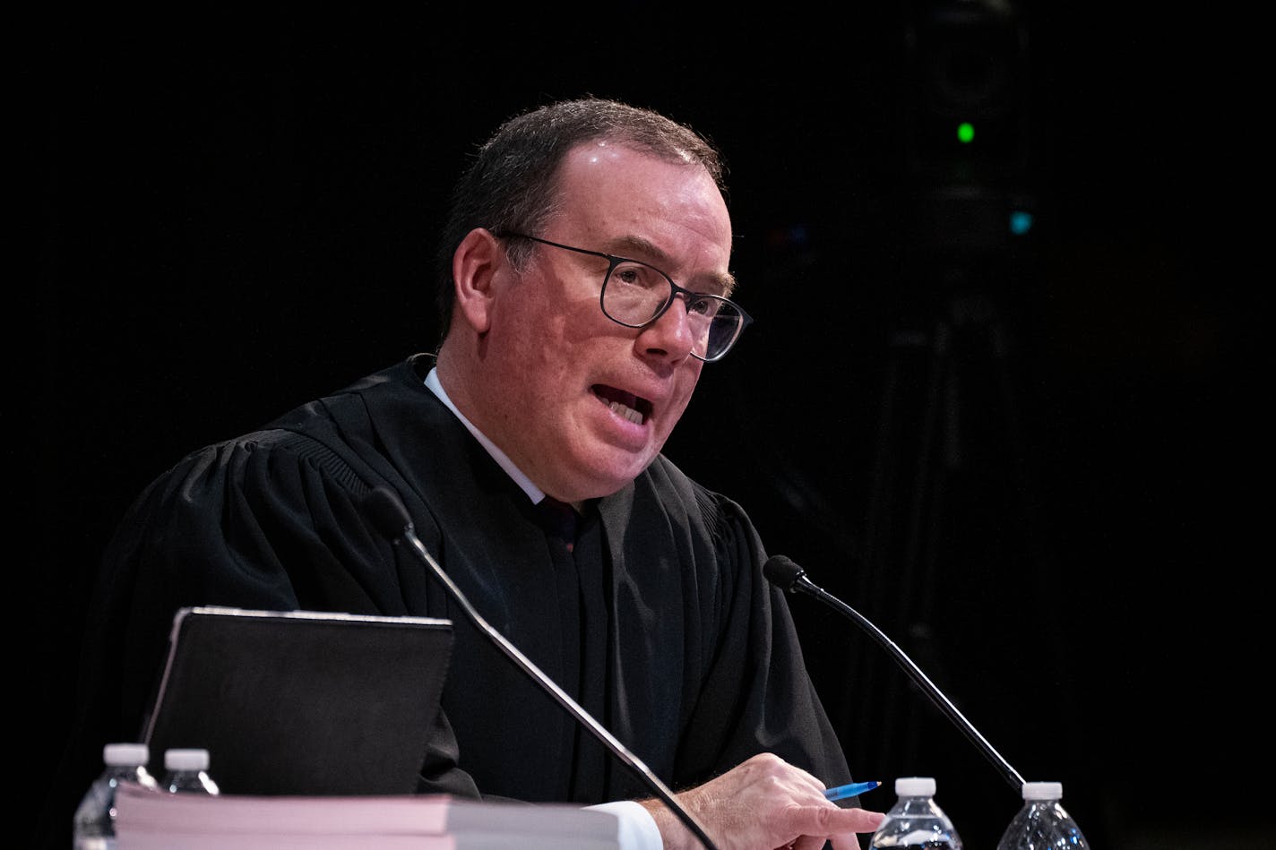 Associate Justice Gordon Moore asks questions as the Minnesota Supreme Court hears oral arguments in the case Cruz-Guzman v. State of Minnesota inside the auditorium at Richfield High School.