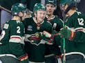 Wild winger Kirill Kaprizov, center, celebrated with teammates after scoring a goal in the second period Tuesday at Xcel Energy Center.
