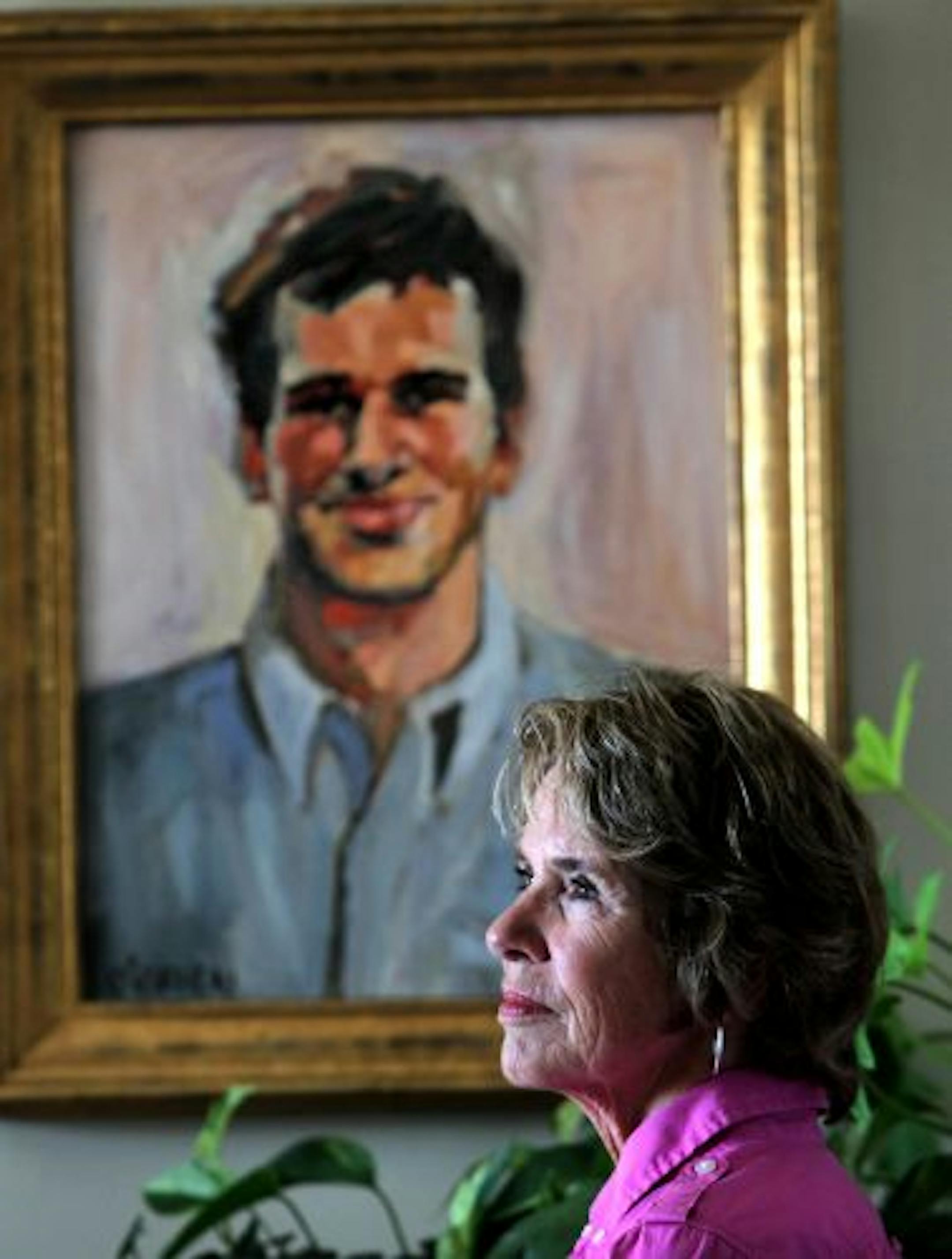 Author Mary Rondeau Westra reflected near a portrait of her son, Peter, in her White Bear Lake home.