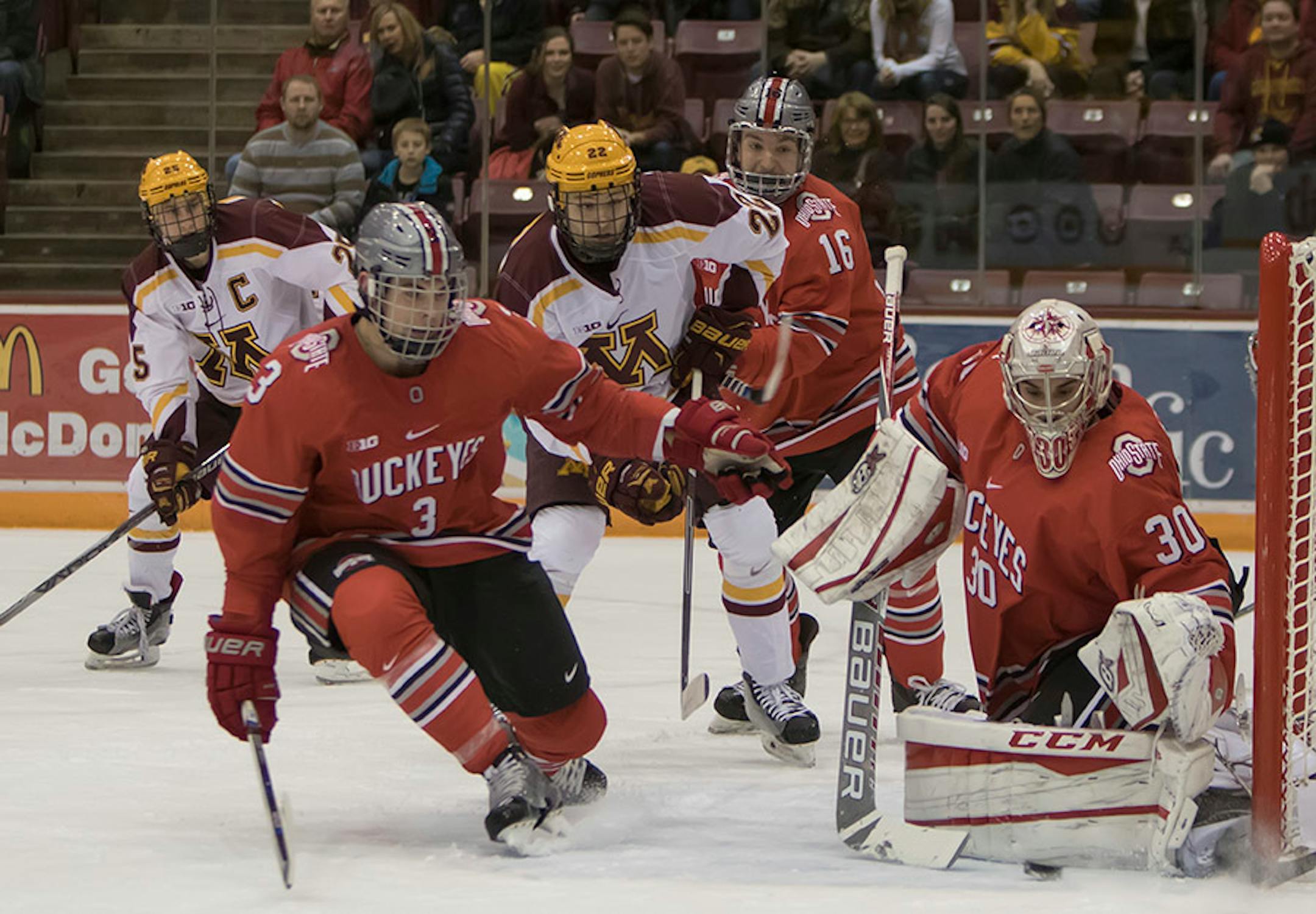 Ohio State Buckeyes goalie Christian Frey (30) makes a save with Minnesota Golden Gophers forward Tyler Sheehy (22) waiting for a rebound, defended by Ohio State Buckeyes defenseman Sasha Larocque (3) and Ohio State Buckeyes forward Matthew Weis (16) as the Minnesota Golden Gophers hosted the Ohio State Buckeyes to open the Big Ten Conference schedule on December 4, 2015. ] Special to Star Tribune MATT BLEWETT ï matt@mattebphoto.com - December 4, 2015, Minneapolis, MN, Big Ten Hockey, Minnesota