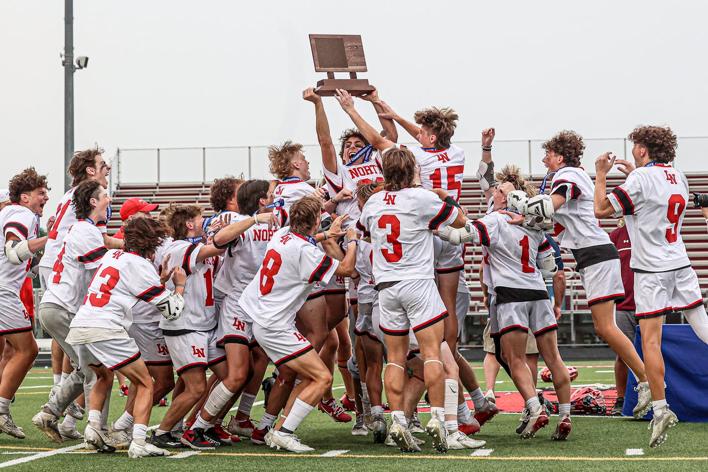 Lakeville North celebrated its boys lacrosse state championship victory over Prior Lake on Saturday