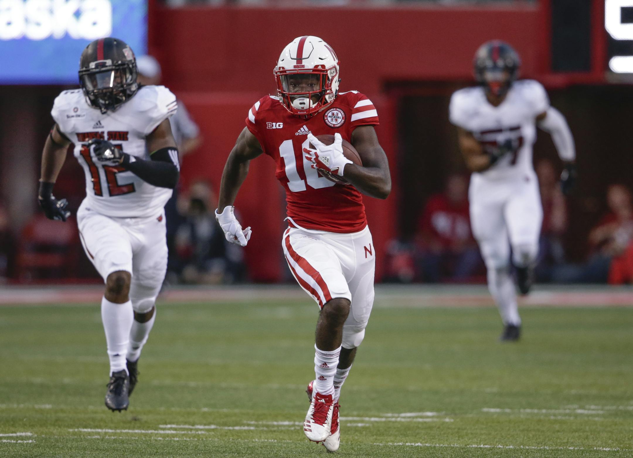 Nebraska wide receiver JD Spielman (10) is chased by Arkansas State defensive back Kyle Martin (12) as he return a punt for a touchdown during the first half of an NCAA college football game in Lincoln, Neb., Saturday, Sept. 2, 2017. (AP Photo/Nati Harnik)