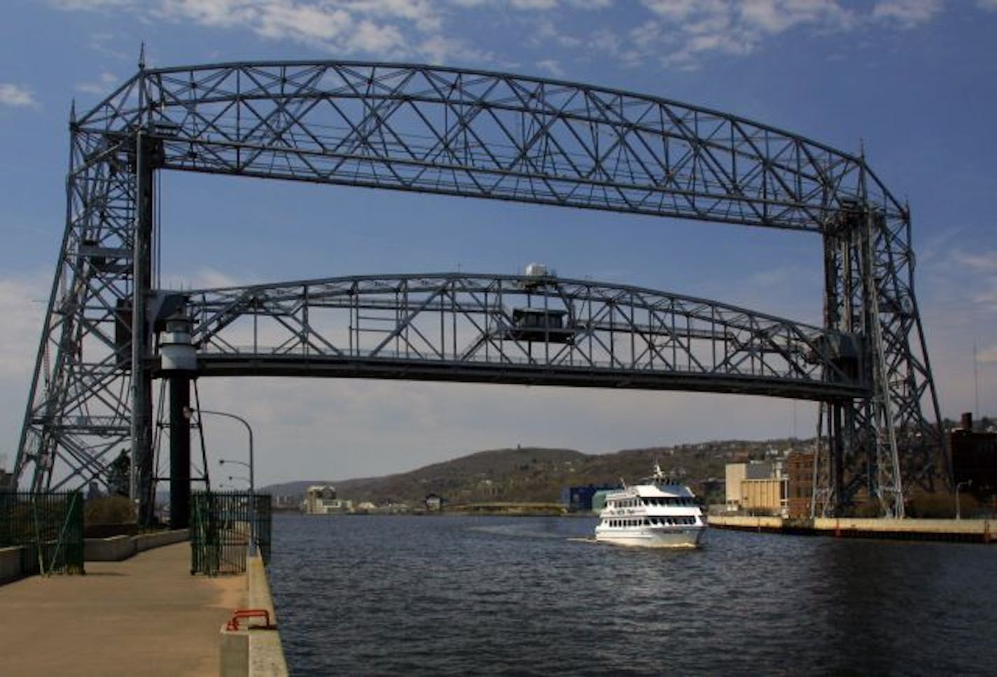 The cruise vessel Vista Star leaves for a lunchtime tour of the area and the bridge needs to rise only about 1/2 way to accomodate it.