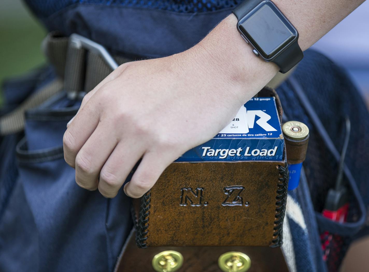 Nathan Ziemer, 15, of the Wayzata High School Trap Team, sports a monogrammed ammo belt. ] (Leila Navidi/Star Tribune) leila.navidi@startribune.com BACKGROUND INFORMATION: The Wayzata High School Trap Team paired up with the Plymouth Police on Tuesday, August 9, 2016 for some friendly trap shooting at the Plymouth Gun Club. In Minnesota, trap shooting is the fastest growing high school sport, with nearly 9,000 students participating in clay target shooting, more than those who play boys' ice hoc