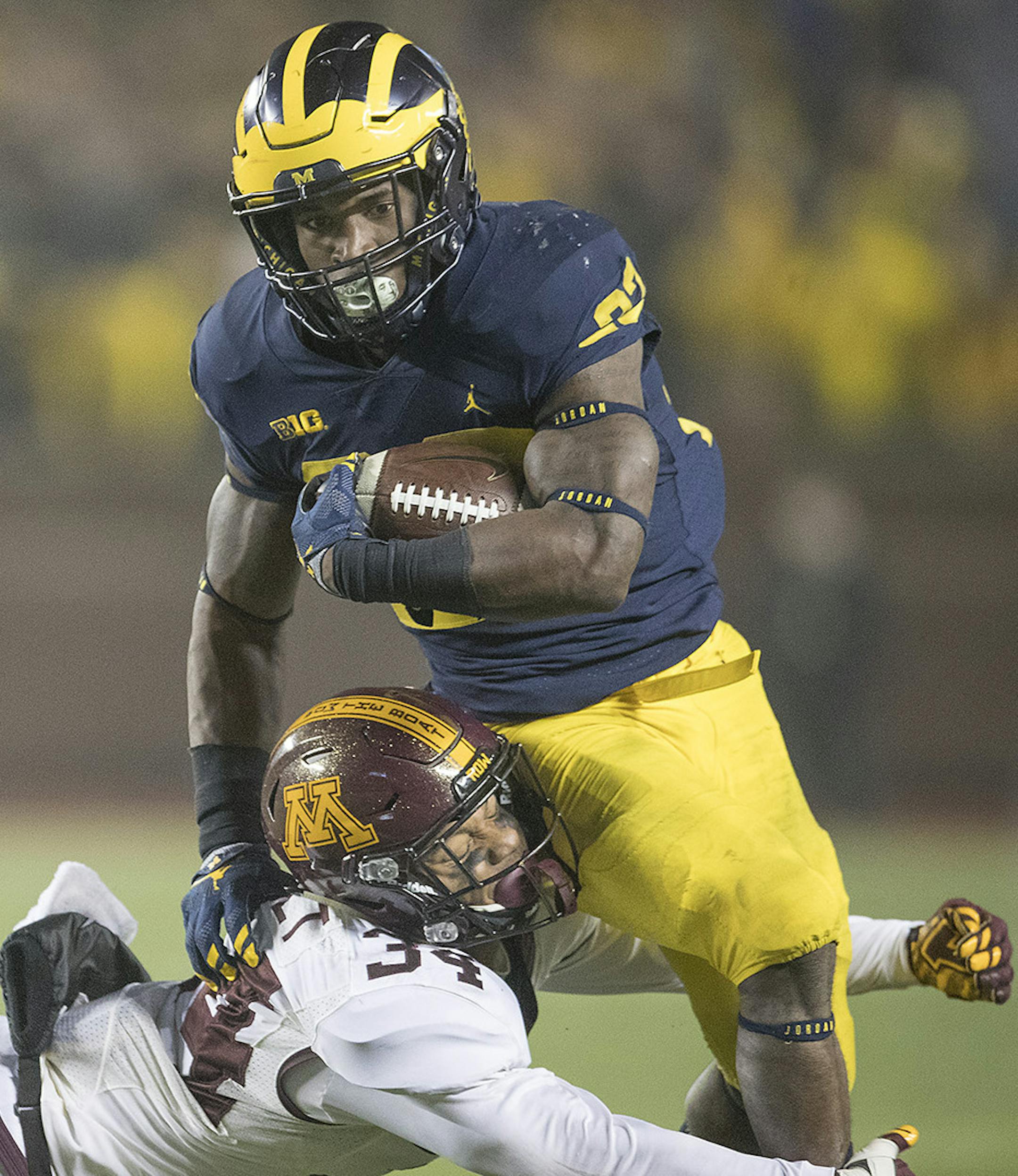 Minnesota's defensive back Antonio Shenault stopped Michigan's running back Karan Higdon during the third quarter the Gophers took on Michigan in Michigan Stadium, Saturday, November 4, 2017 in Ann Arbor, MI. ] ELIZABETH FLORES ï liz.flores@startribune.com