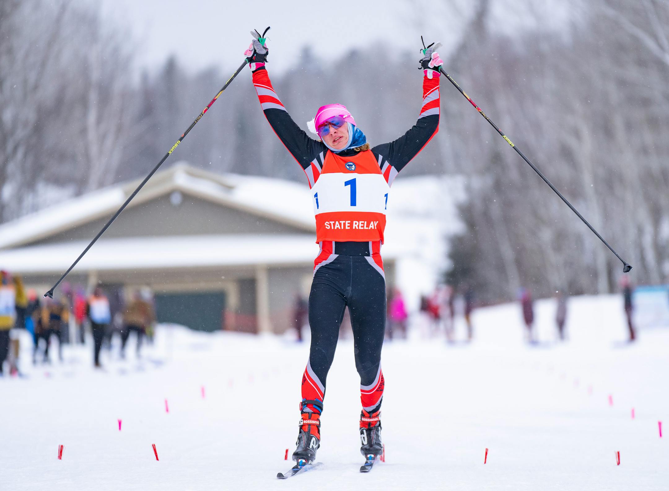 Duluth East nordic skier James Kyes (1) celebrates after he crosses the finish line to take first place in the boy's team sprint final during the MSHSL Boys and Girls Nordic Ski Racing Meet.