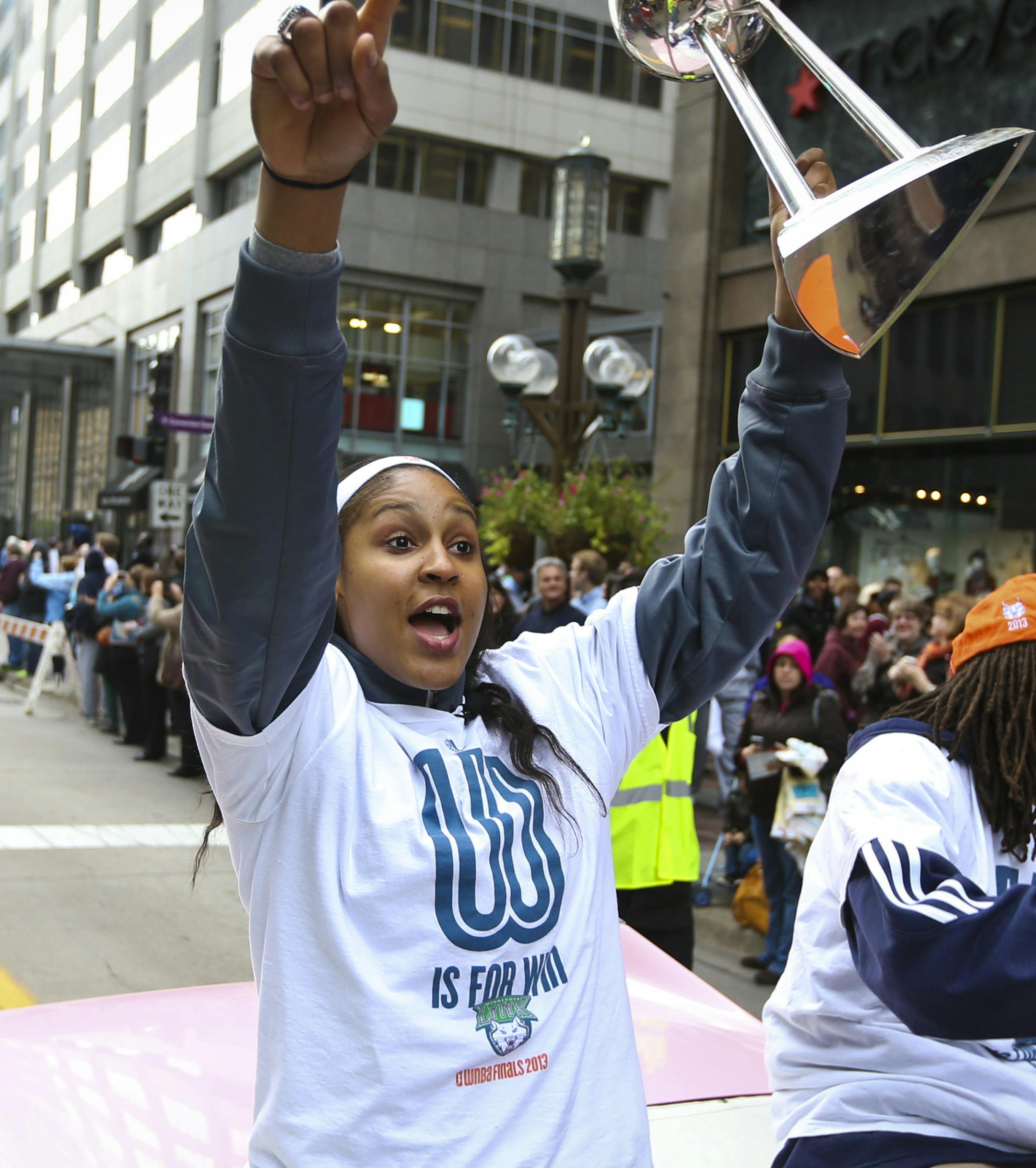 Lynx player Maya Moore raised up the trophy for the fans to see during a championship celebration parade for the WNBA champions on Monday, October 14, 2013, through downtown Minneapolis, Minn.] RENEE JONES SCHNEIDER &#x2022; reneejones@startribune.com