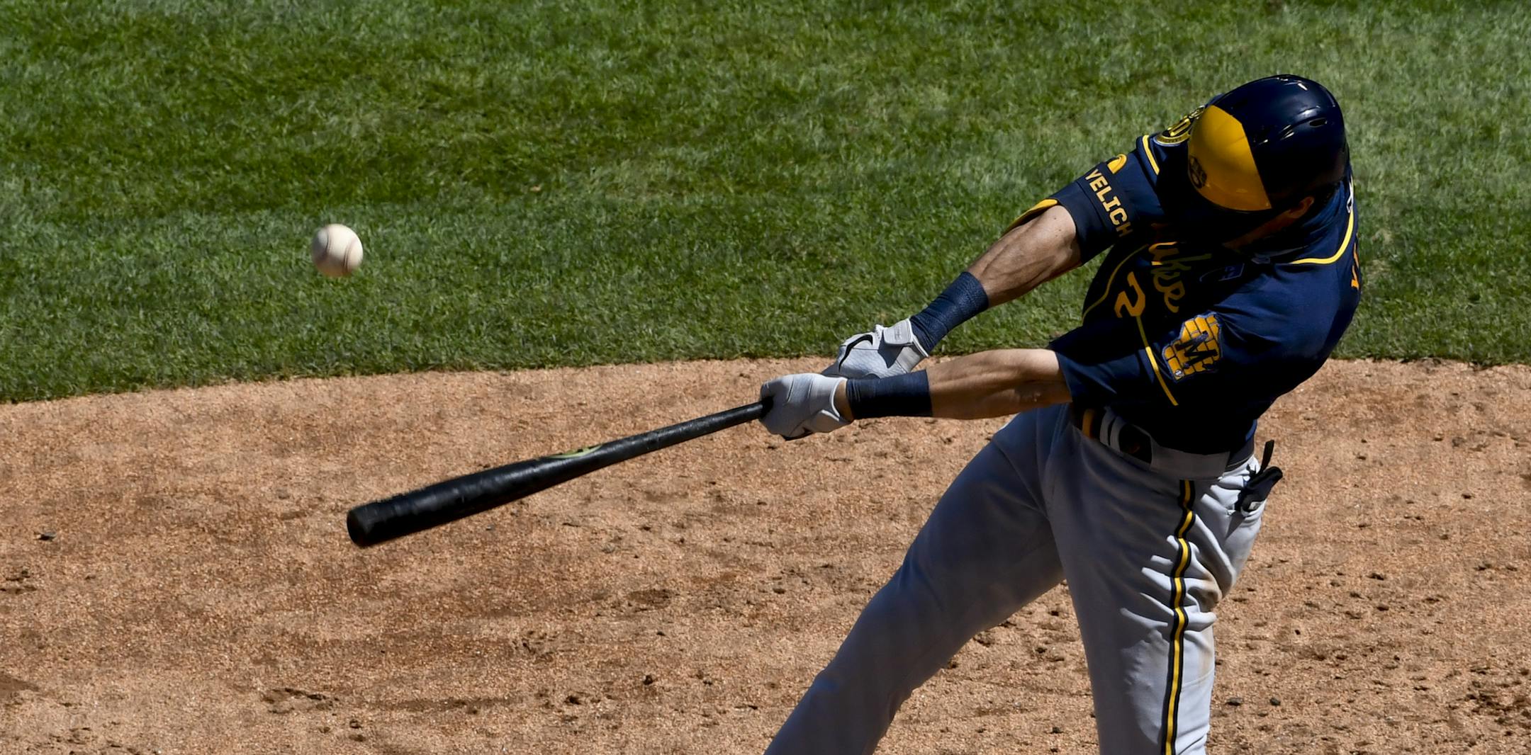 Milwaukee Brewers' Christian Yelich hits a double against the Chicago Cubs during the fifth inning of a baseball game, Sunday, Aug. 16, 2020, in Chicago. (AP Photo/Matt Marton)