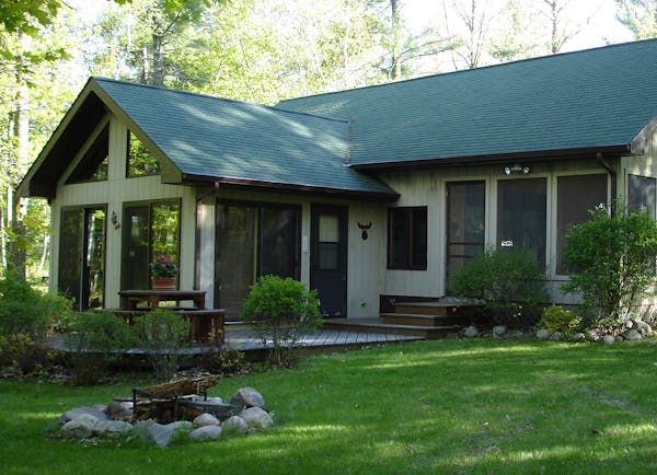 The place in the woods got a considerable upgrade in 2000 when a larger cabin was built, with a basement, running water and a large, screened porch.