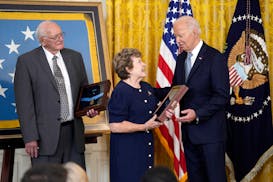 President Joe Biden presents the Medal of Honor to Theresa Chandler, the great-great-granddaughter of Pvt. George D. Wilson in the East Room at the Wh