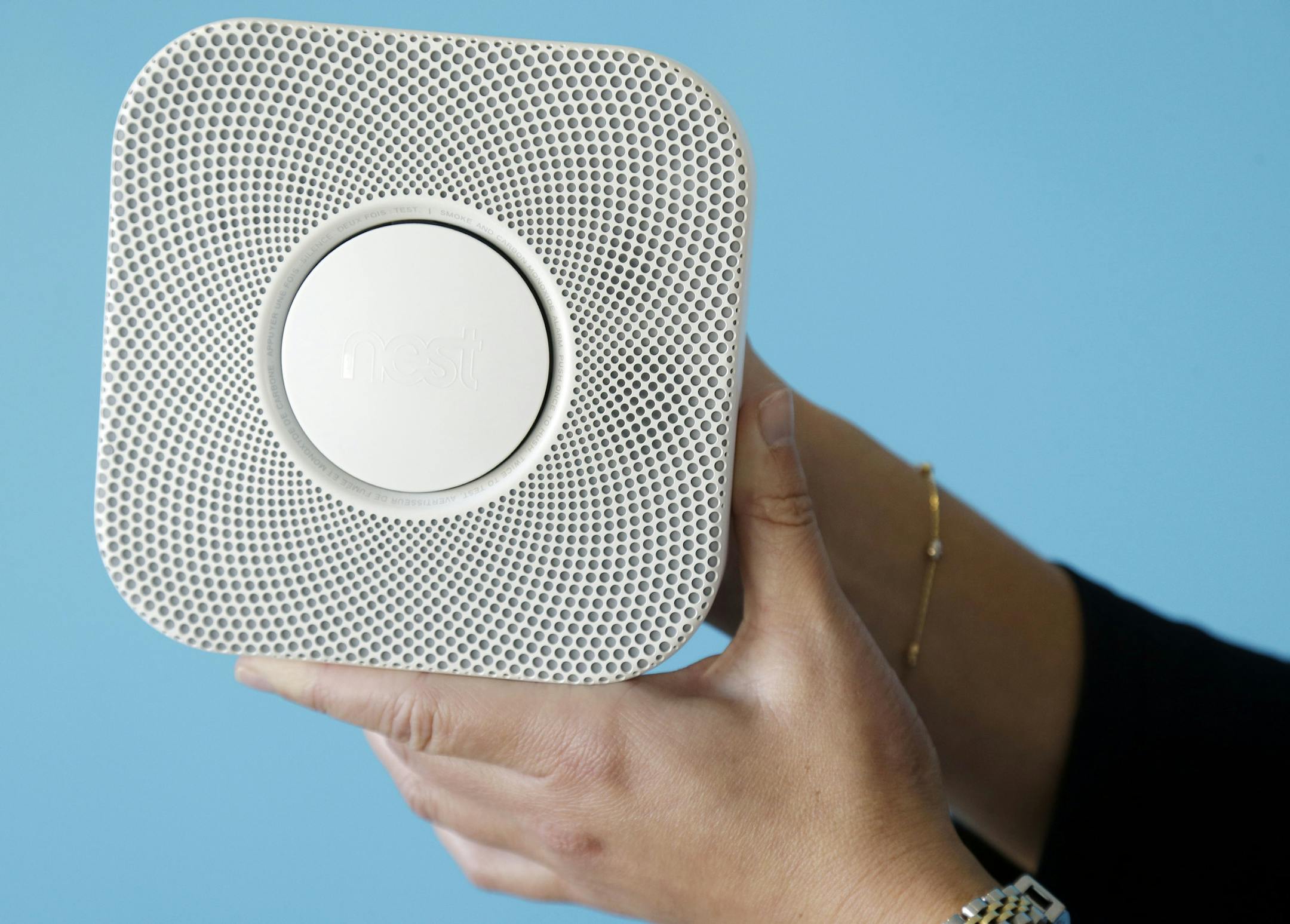 The Nest smoke and carbon monoxide alarm is shown at the company's offices on Tuesday, Oct. 1, 2013, in Palo Alto, Calif. Tony Fadell, a gadget guru who helped design the iPod and original iPhone while working at Apple, is counting on his latest innovation to prove that a smoke detector can be sleek, smart and appreciated. (AP Photo/Marcio Jose Sanchez) ORG XMIT: CAMS203
