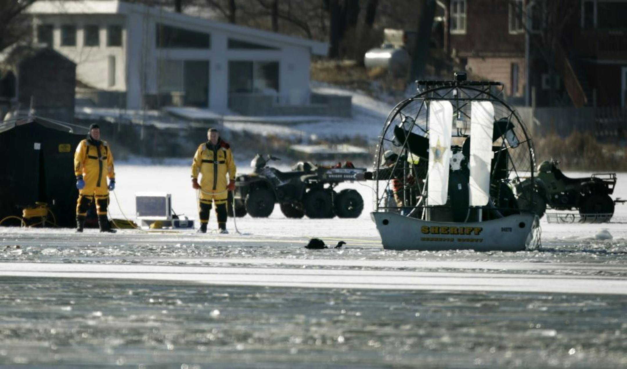 Hennepin County Sheriff department divers search for two bodies on Sunday afternoon January 15, 2012 on Lake Charlotte in Rockford Township