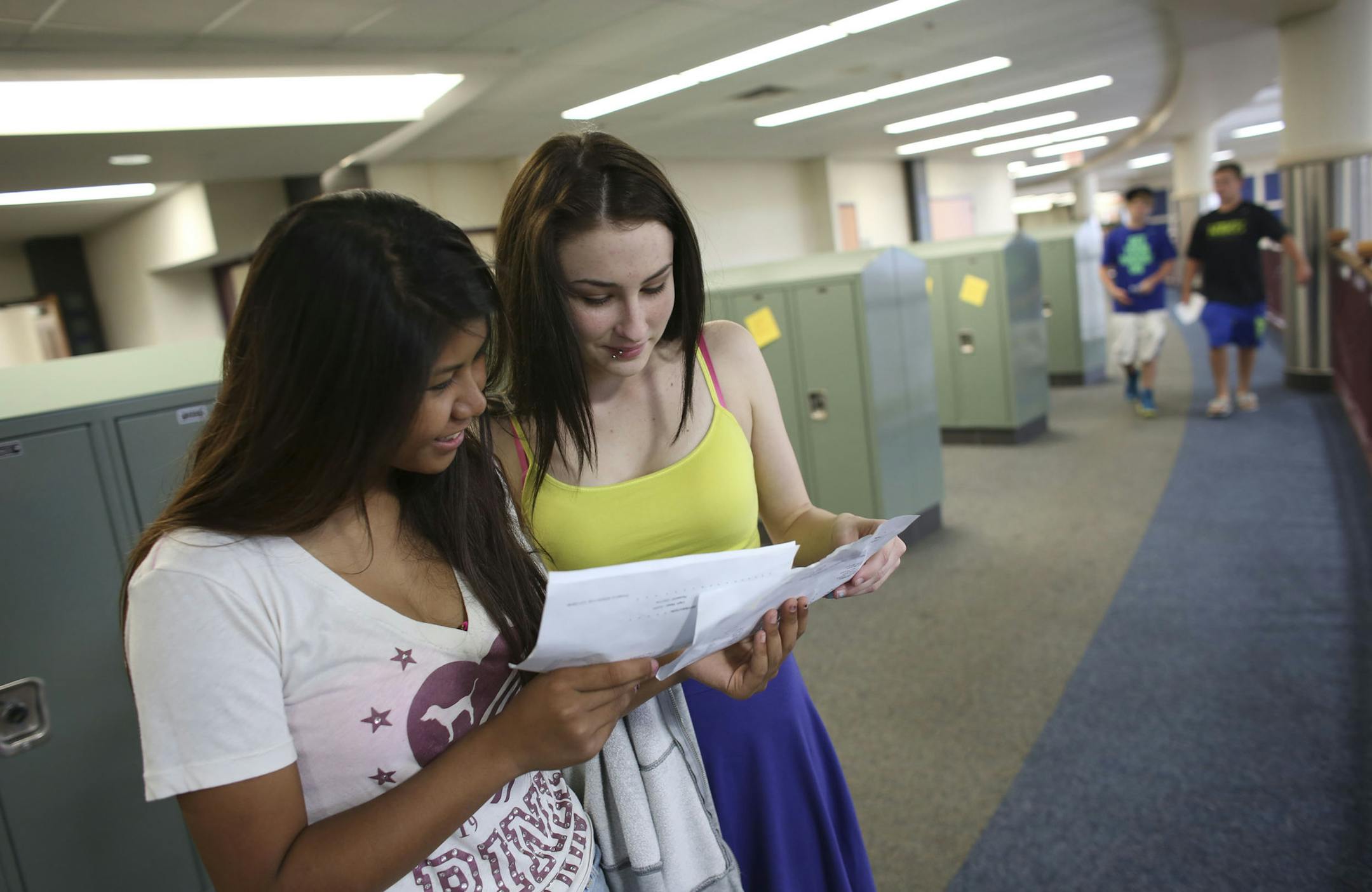Freshmen Marlo Torrence, right, and Lily Chemo tried to figure out which lunch time they had during class changing during freshman orientation at Prior Lake High School in Savage Min., Tuesday, August 20, 2013. ] (KYNDELL HARKNESS/STAR TRIBUNE) kyndell.harkness@startribune.com
