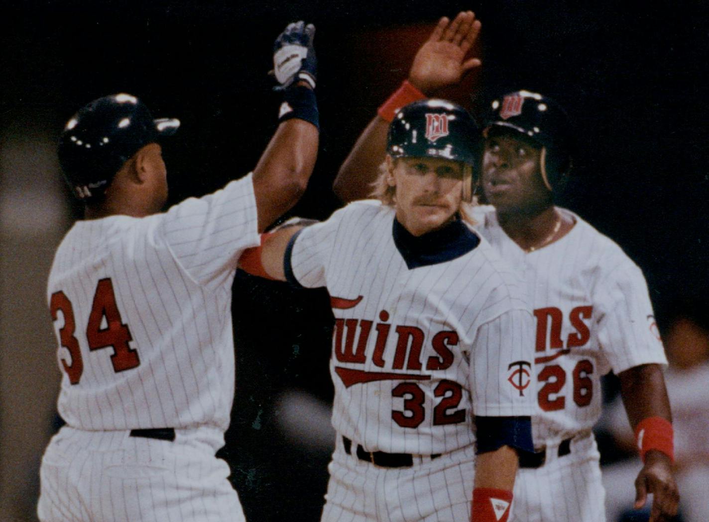 June 26, 1990 The Twins's Kirby Puckett exchanged high-fives with Dan Gladden and Al Newman after they scored on Puckett's fourth-inning home run. David Brewster, Minneapolis Star Tribune