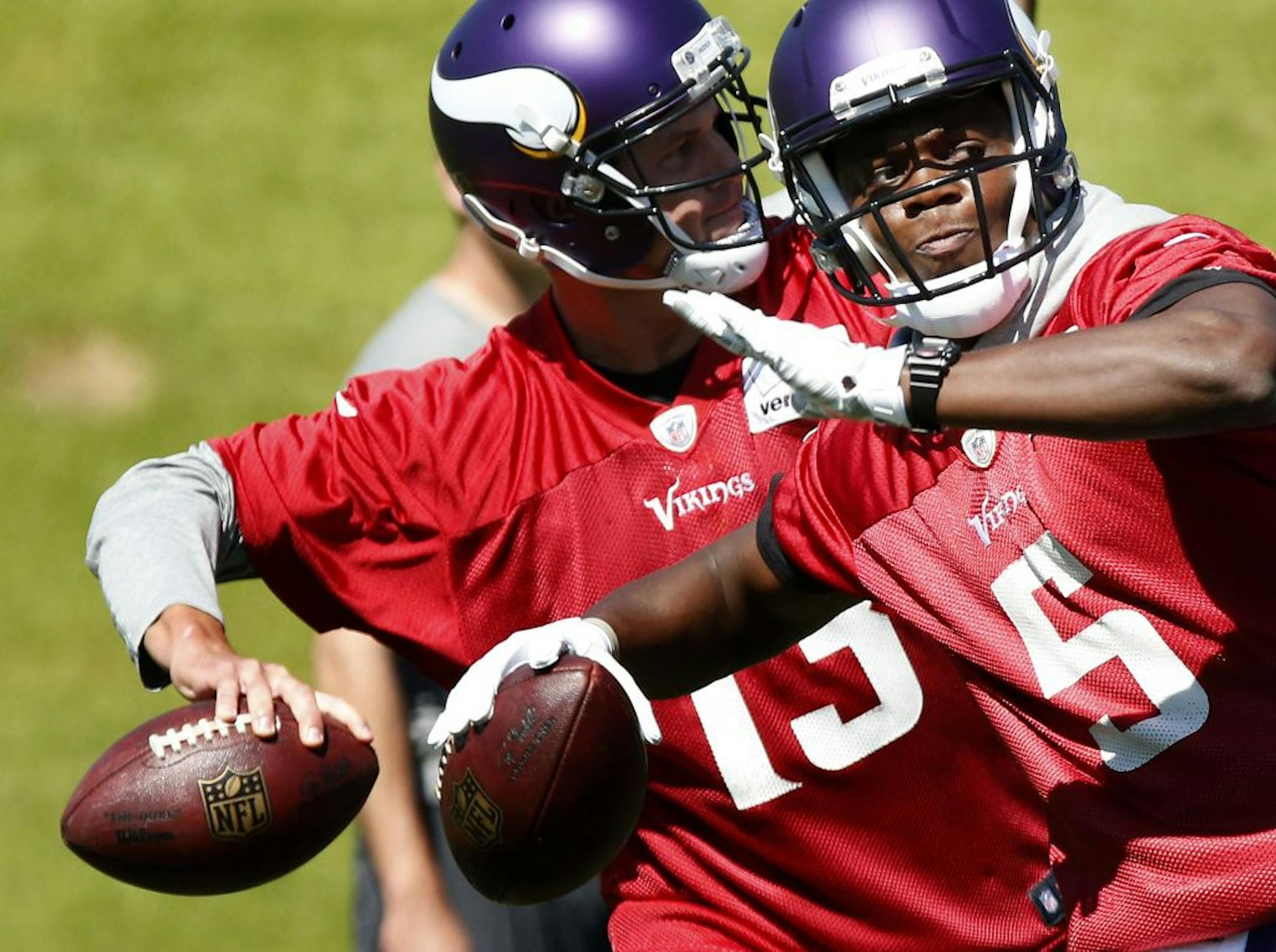 Minnesota Vikings quarterbacks Shaun Hill (13) and Teddy Bridgewater (5) during the first day of Minicamp.