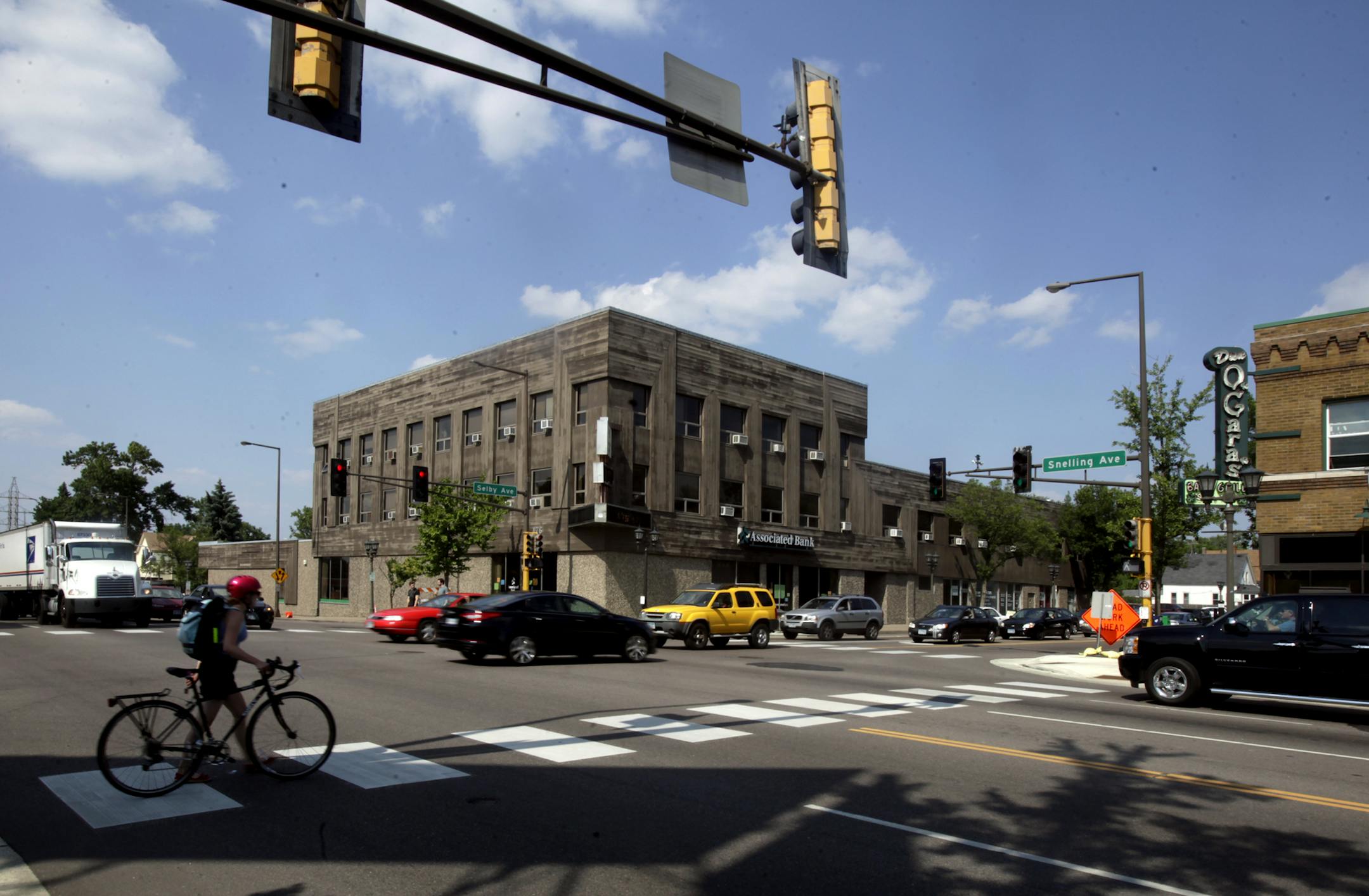 Associated Bank branch at the corner of Snelling Ave. and Selby Ave. in St. Paul (just off the Snelling exit on 94), across Selby from O'Gara's. July 10, 2013. ] JOELKOYAMA&#x201a;&#xc4;&#xa2;joel koyama@startribune.com Ryan Cos. has proposed a mixed-use grocery-anchored development for a budding corner in St. Paul's Merriam Park neighborhood. The plan calls for a grocery store and 200 market-rate apartments in an area near O'Gara's bar that has blossomed in recent years.
