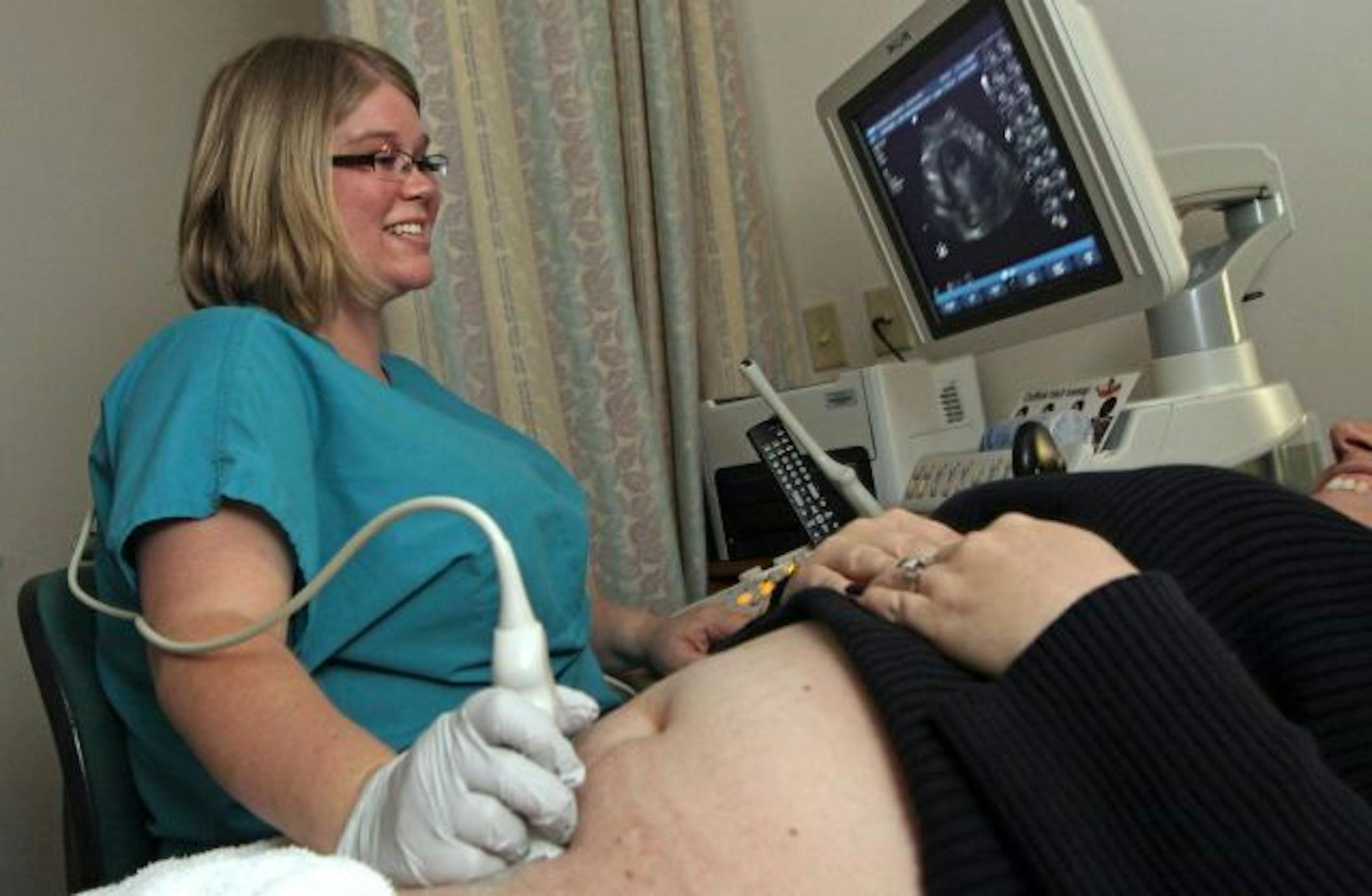 Sonographer Stephanie Dickinson is herself 28 weeks pregnant.