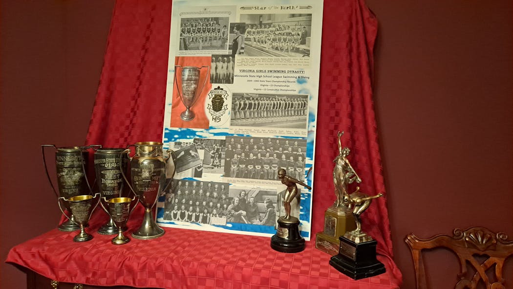 An arrangement of trophies won by Virginia’s teams in the early girls swimming era.