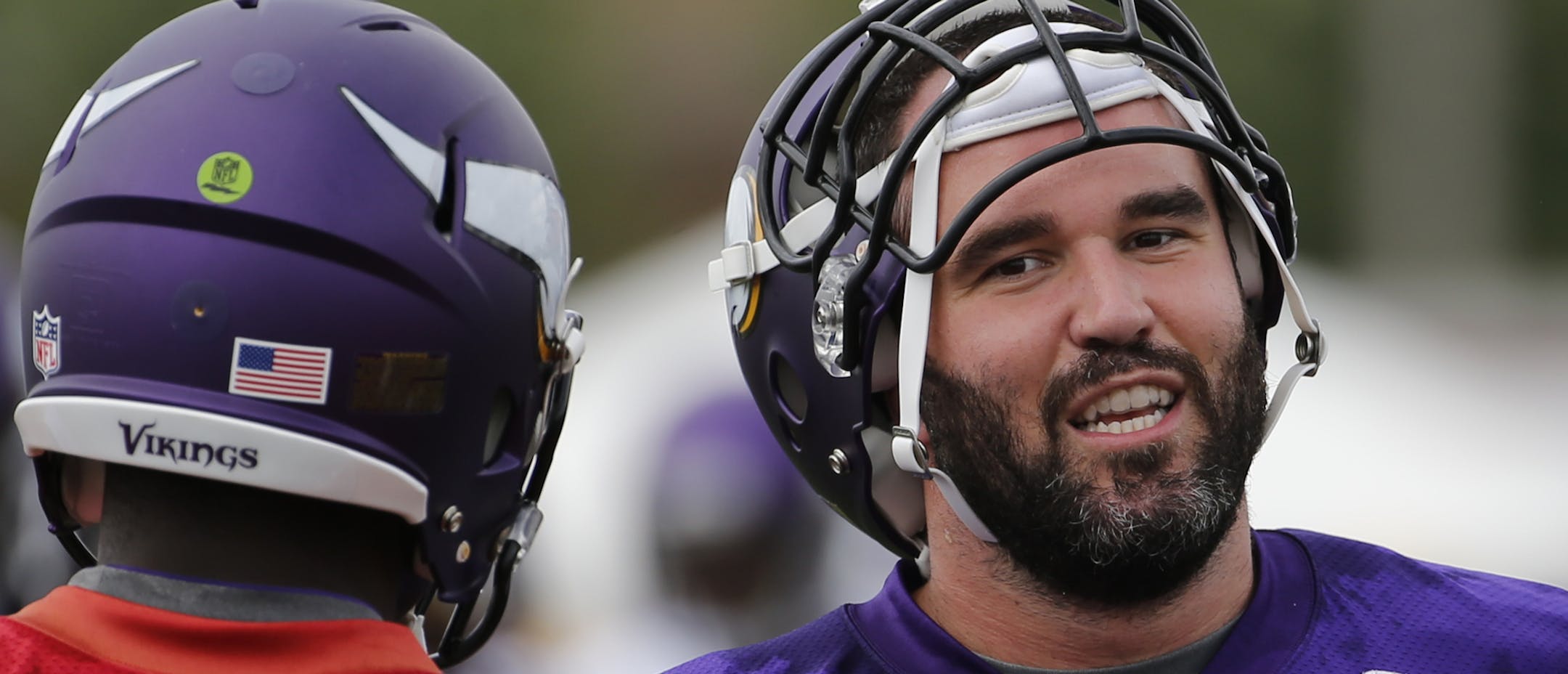 Minnesota Vikings center John Sullivan (65) talks to quarterbacks Teddy Bridgewater and Mike Kafka, during practice at an NFL football training camp on the campus of Minnesota State University Monday, July 27, 2015, in Mankato, Minn. (AP Photo/Charles Rex Arbogast)