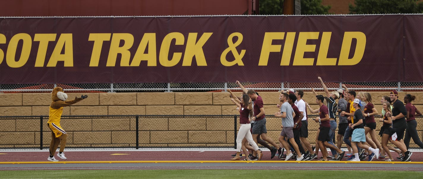 Goldy Gopher and U of M athletes took to the track for the inaugural lap
.] Grand opening of the U's track and field complex, and the long road it took to its birthdayRichard.Tsong-Taatarii@startribune.com] Grand opening of the U's track and field complex, and the long road it took to its birthdayRichard.Tsong-Taatarii@startribune.com