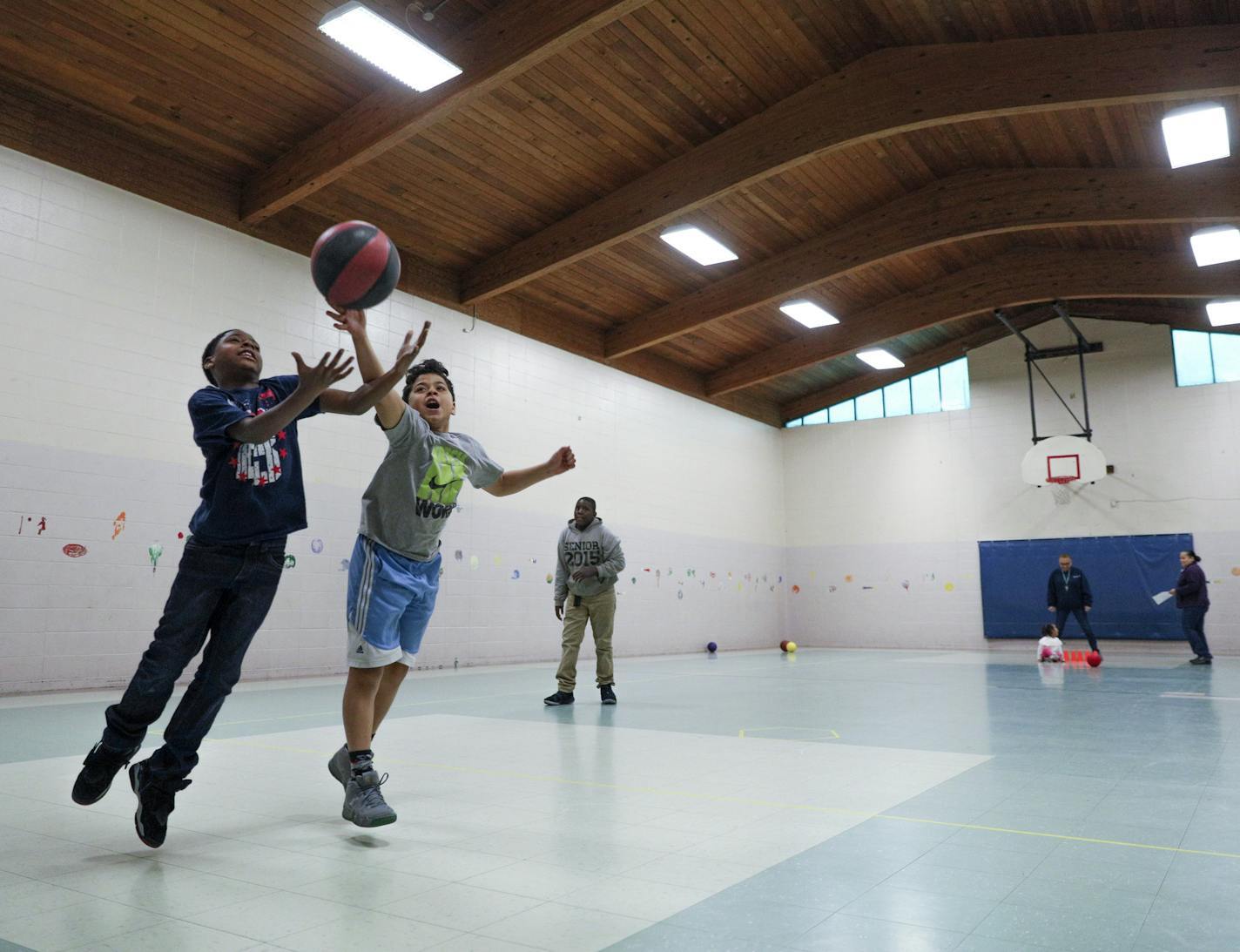 The Scheffer Recreation Center will be completely rebuilt this year. It's included in the Parks Department's first-ever ADA Transition Plan, which lists updates the department needs to make to parks facilities over the next five years in order to comply with the ADA. Here, boys play basketball in the gym that is not large enough to hold a regulation game. ] (No names please.)
BRIAN PETERSON &#xef; brian.peterson@startribune.com
St. Paul, MN 04/12/2018