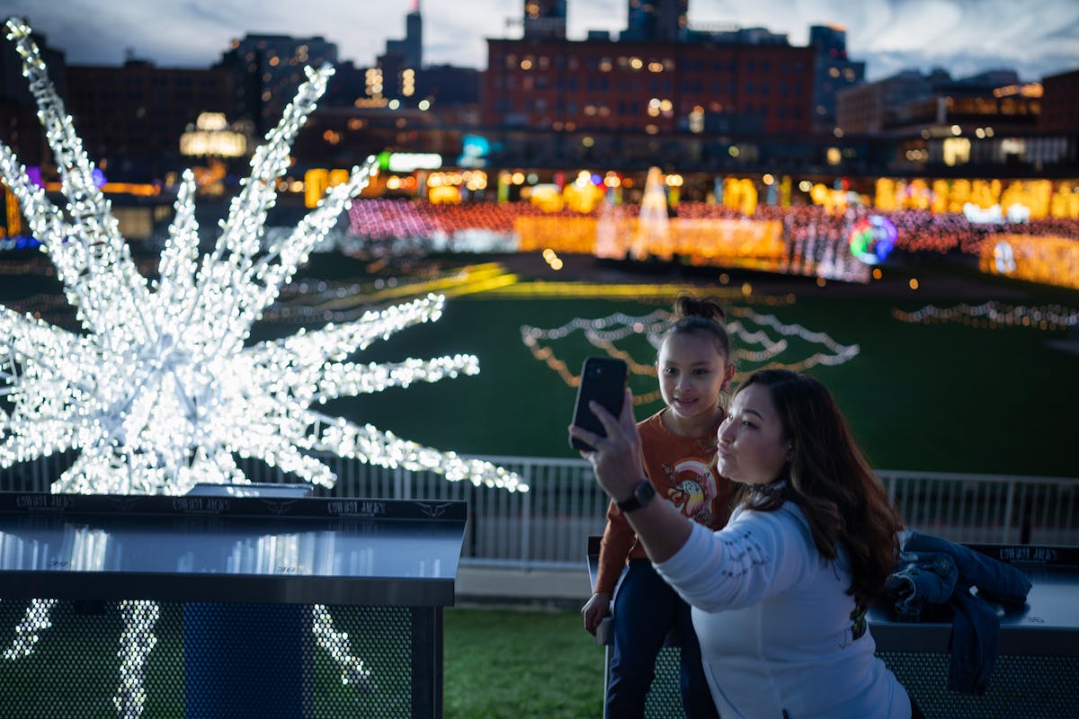 Ana Perez and her daughter Iivy Perez 6, enjoyed the lights at the GLOW Holiday Festival Lights now on display at CHS Field in November.