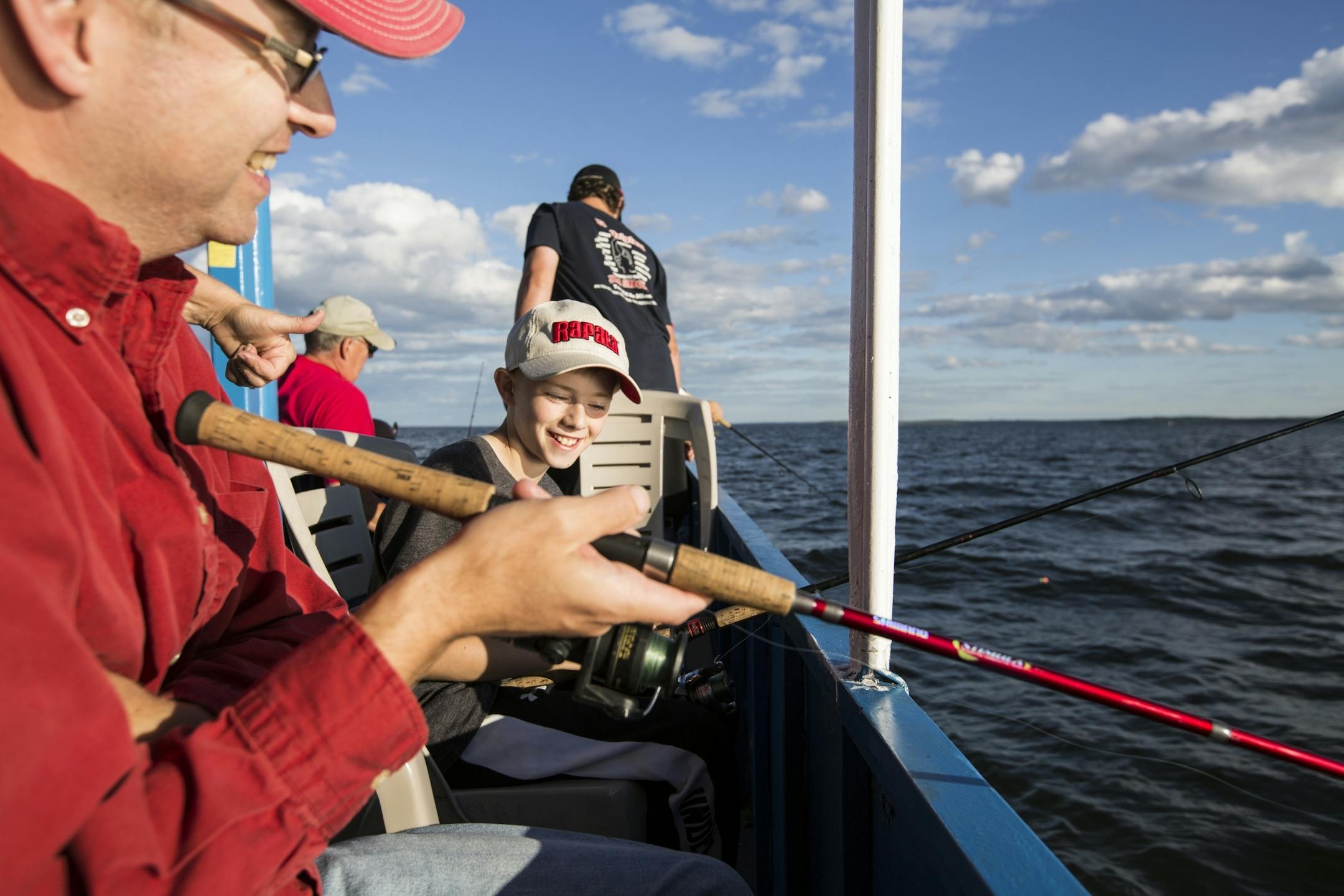 Brent Peterson and his son Wyatt, 10, of Excelsior fish on an expedition with Twin Pines Resort on Mille Lacs Lake Monday, August 3, 2015.