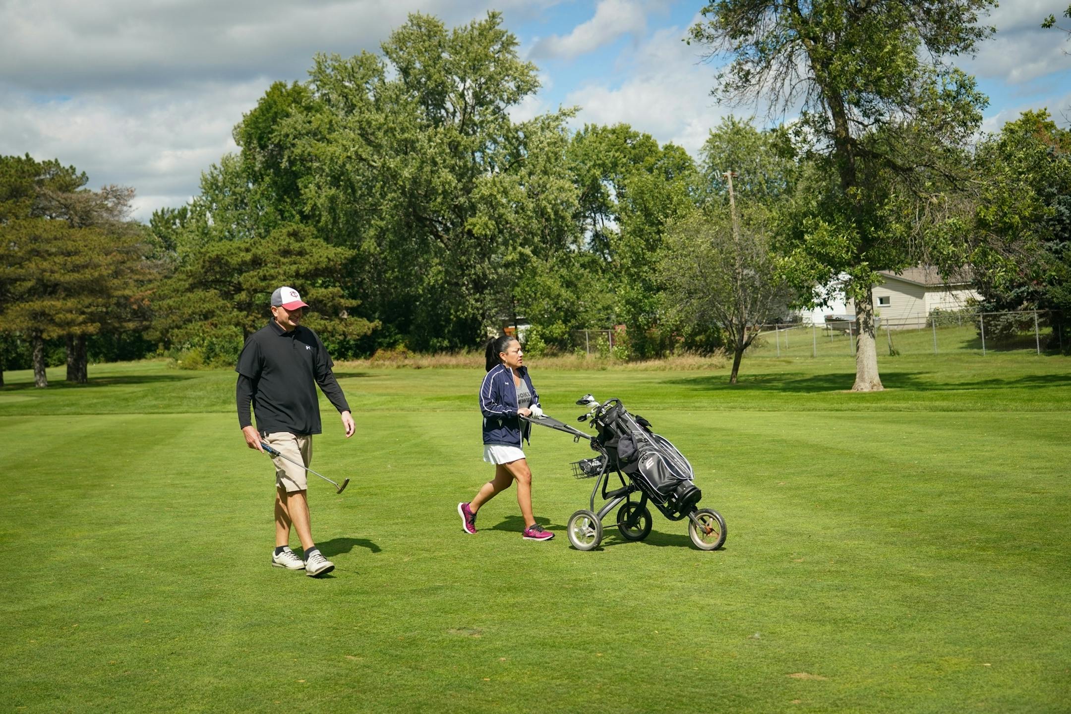 After playing golf for two months, Claudia Murvartian from St. Paul is hooked. She and her boyfriend Charles Mann started the COVID-19 shutdown by walking ten miles a day. When that became boring, she said, she decided to go to the driving range and hit some balls with Mann.
