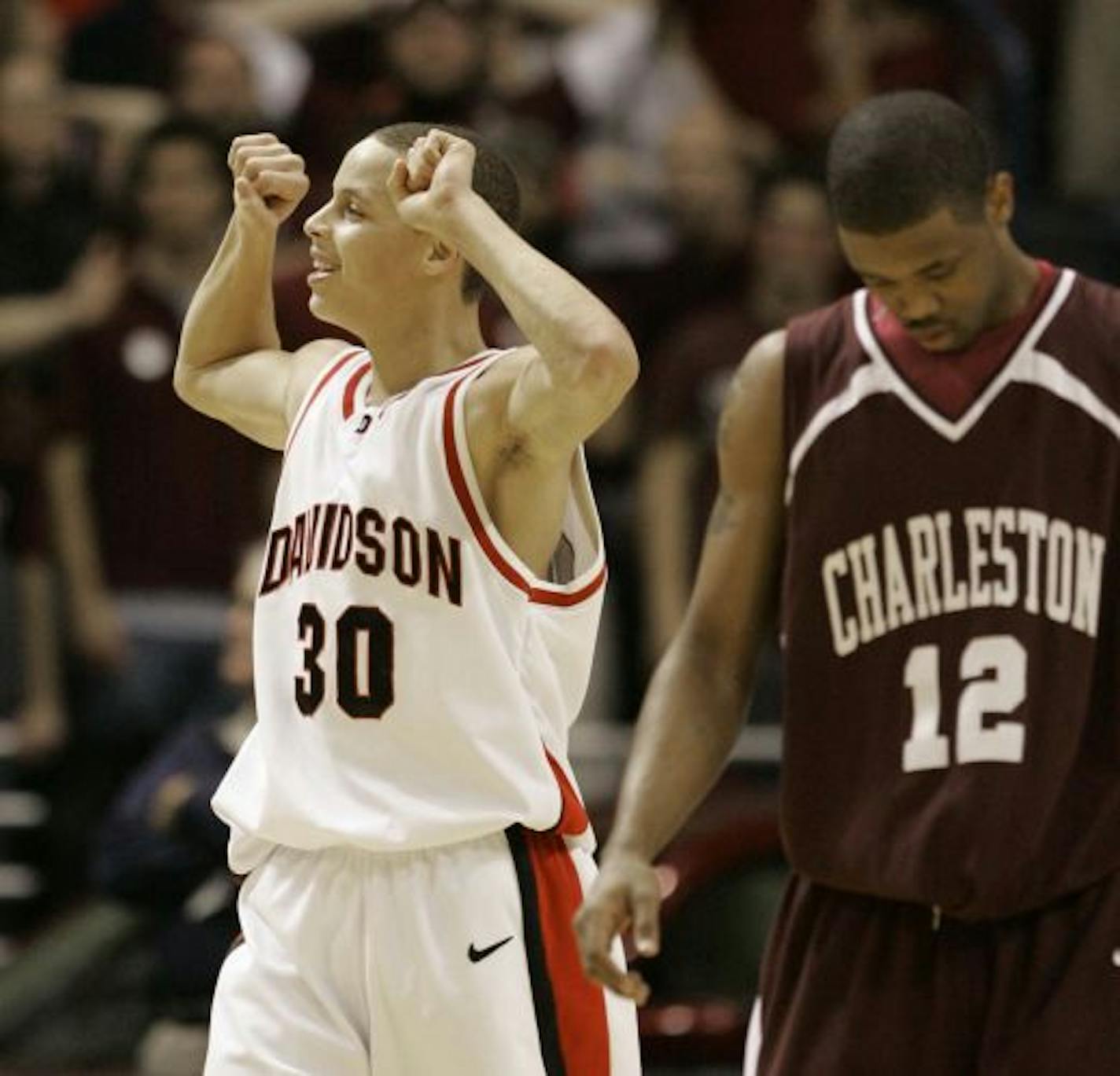 Davidson's Stephen Curry (30) reacts late in the championship game against College of Charleston during the championship game of the Southern Conference basketball tournament in North Charleston, S.C. College of Charleston's Javon Parris is at right. Curry had 29 points as Davidson won 72-65.