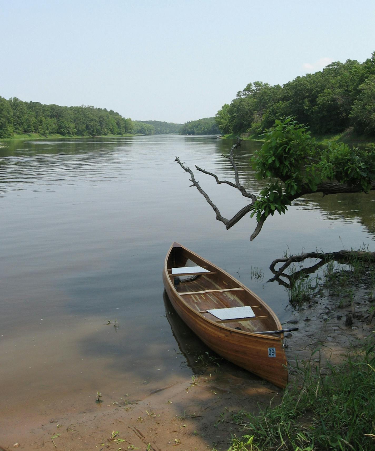 A canoe rests on the shore of the Mississippi River at Crow Wing State Park, Saturday, July 26, 2008, in Brainerd, Minn. Once a thriving town, Crow Wing was the site of Indian conflict and a successful village until the railroad decided to cross the Mississippi to Brainerd, north of the state park. (AP Photo/Brainerd Dispatch, Brian Peterson)