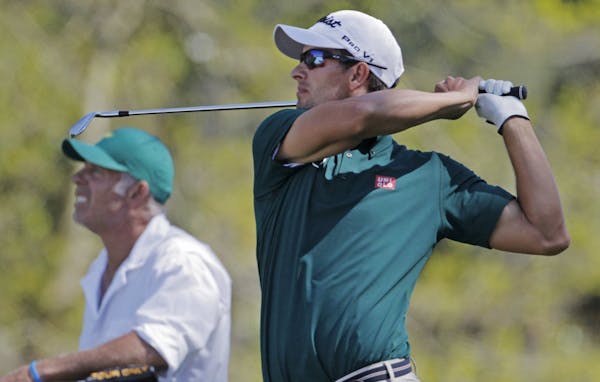 Adam Scott Hits his tee shot on the 18th hole in the first round of the Masters Tournament, Thursday, April 10, 2014, in Augusta, Ga. (Gerry Melendez/