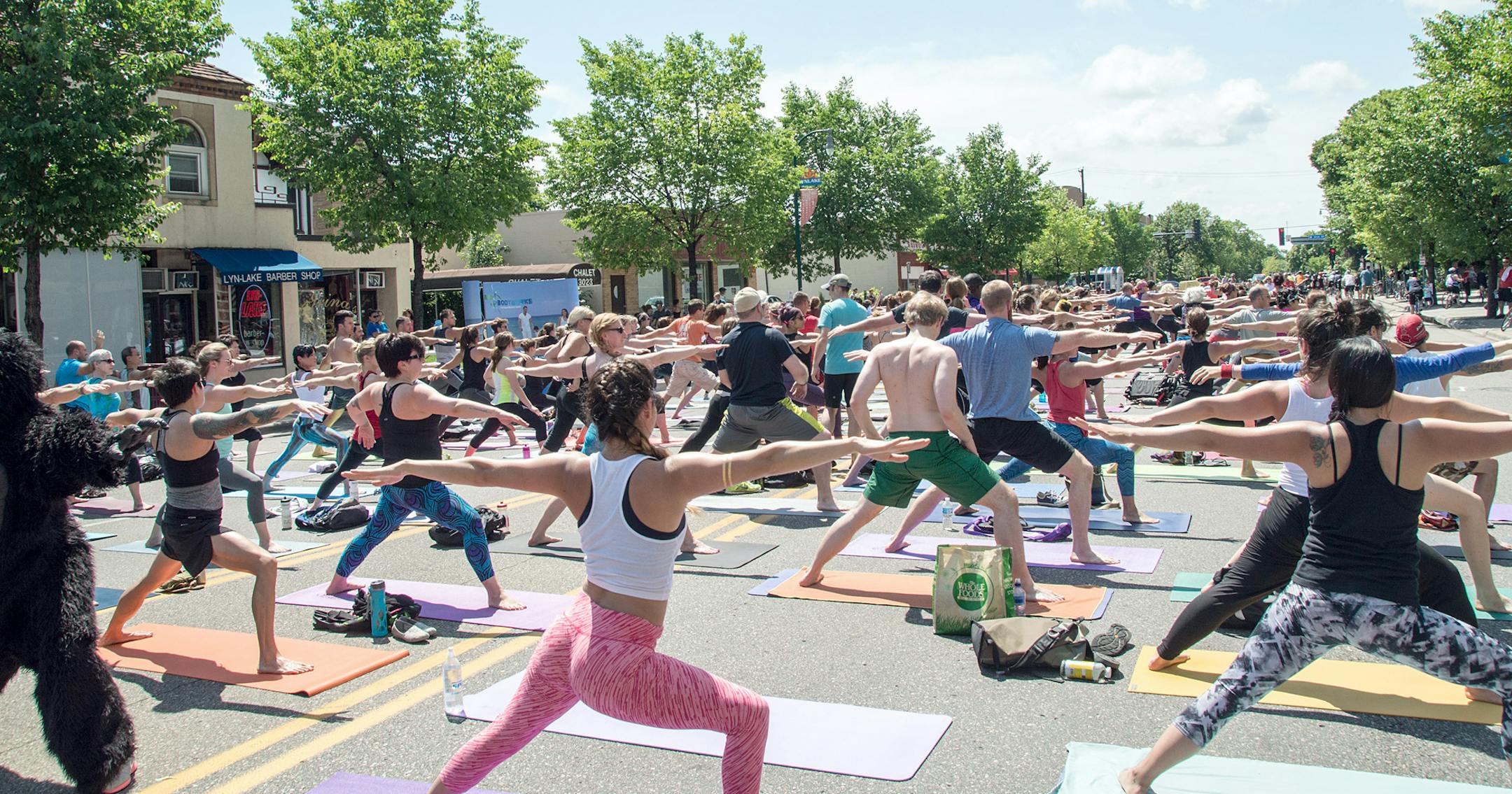 People perform yoga in the middle of Lyndale Avenue during an Open Streets event. (Photo courtesy of Bob Dixon)