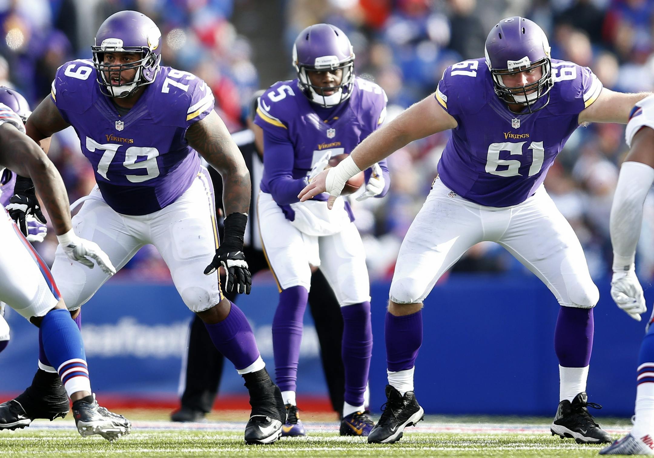 Minnesota Vikings offensive lineman Mike Harris (79) and center Joe Berger (61) i