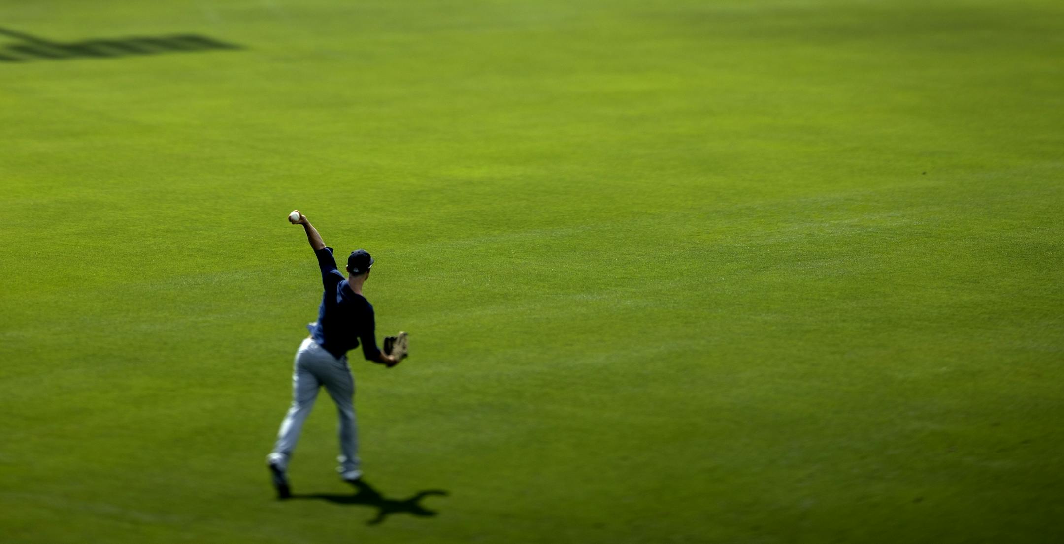 Minnesota Twins outfielders ran fielding drills during the first day of practice for position players.